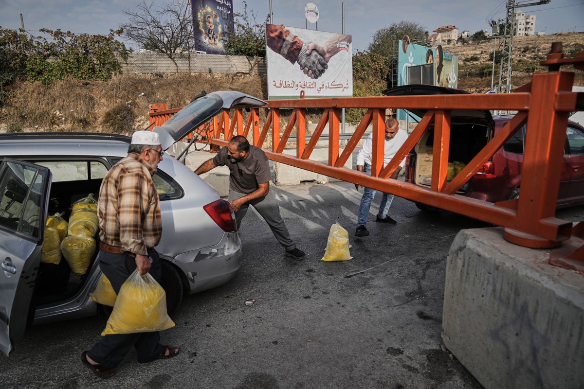 Israel imposes closures across a West Bank city after attacks, and other Mideast news