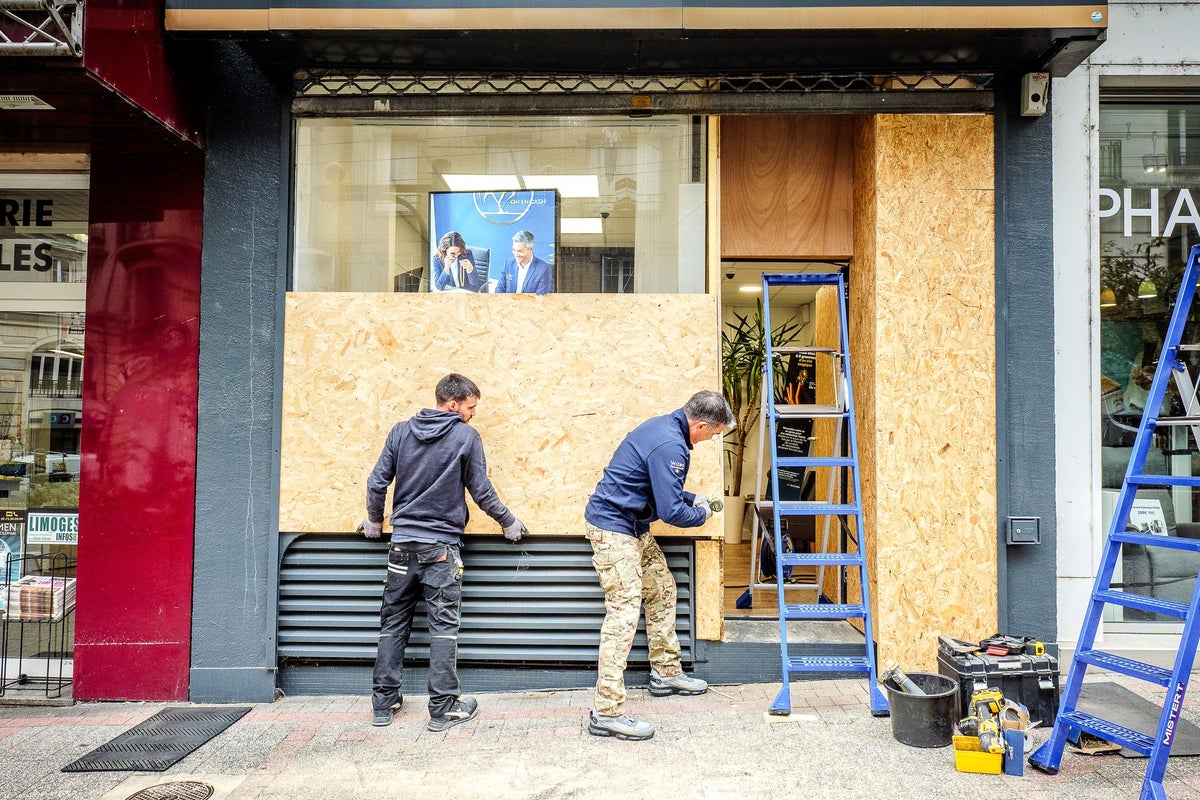 Shop owners in France board up windows ahead of weekend protests