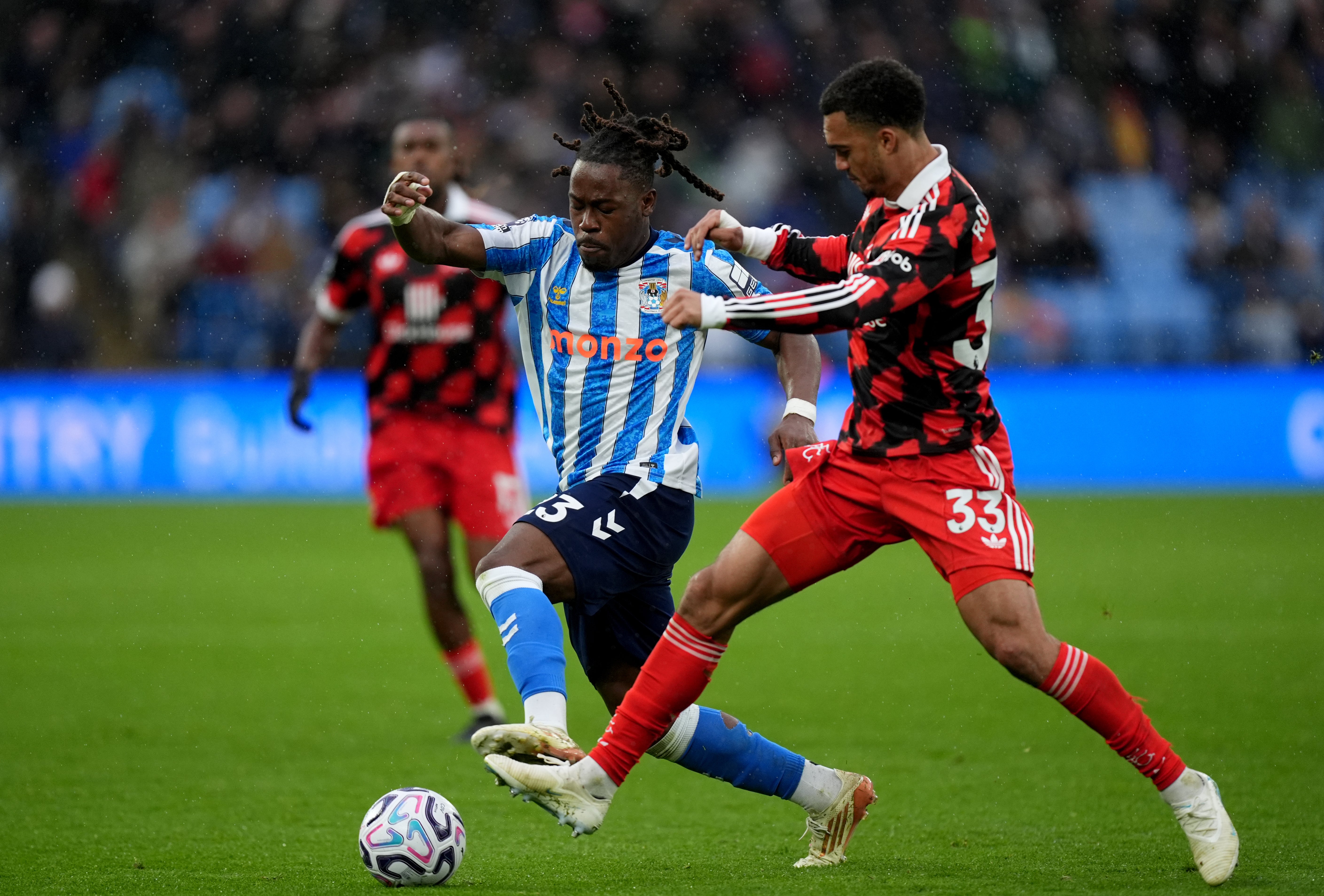 Coventry’s Brandon Thomas-Asante and Fulham’s Antonee Robinson battle for the ball (Mike Egerton/PA).