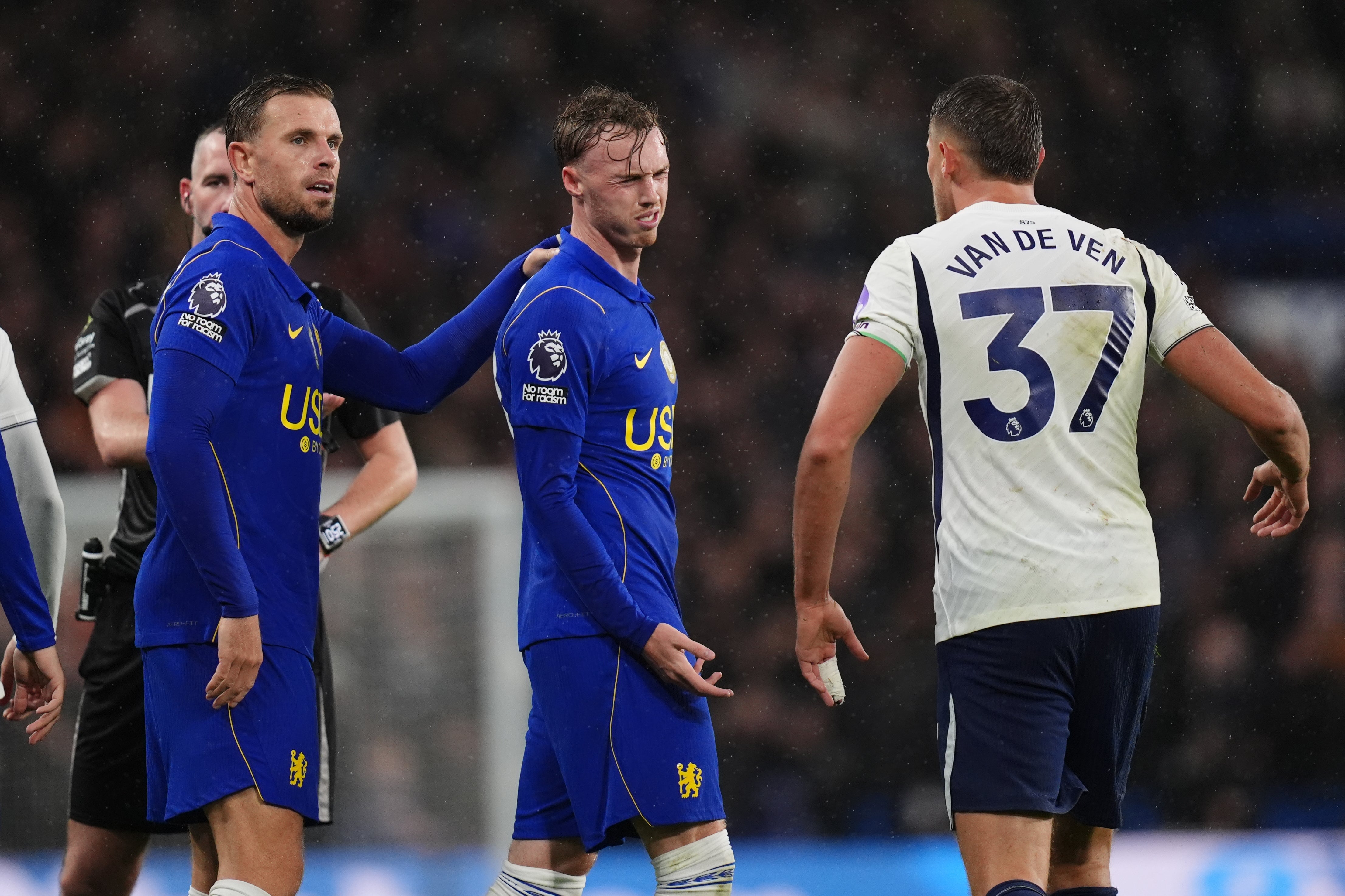 Cole Palmer is confronted by Tottenham’s Micky van de Ven