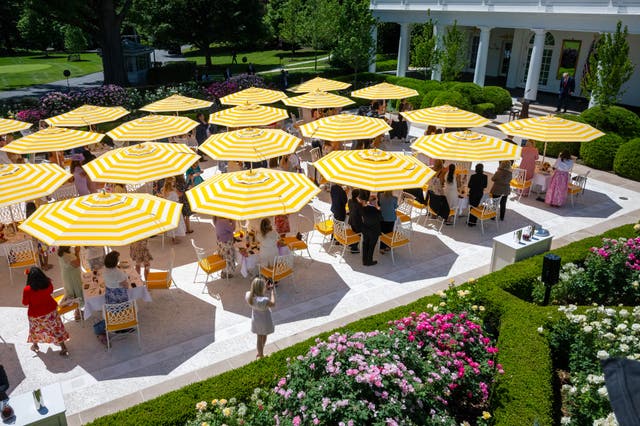 Tables with yellow-and-white striped umbrellas — reminiscent of those at Trump’s Mar-a-Lago estate in Palm Beach, Florida — fill the concrete patio, a project the president undertook in the summer of 2025