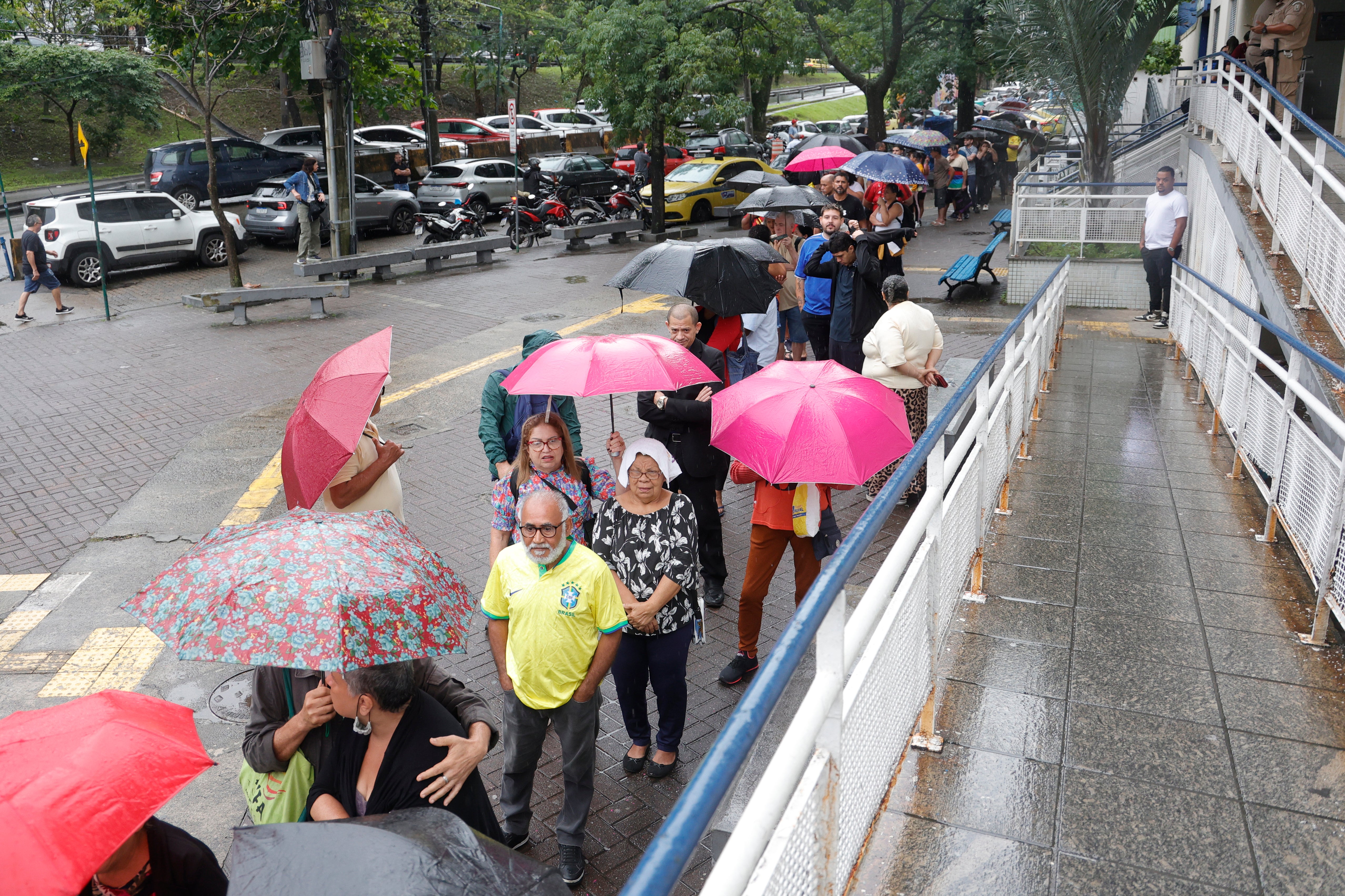 Voters wait in line before polls open in Brazil