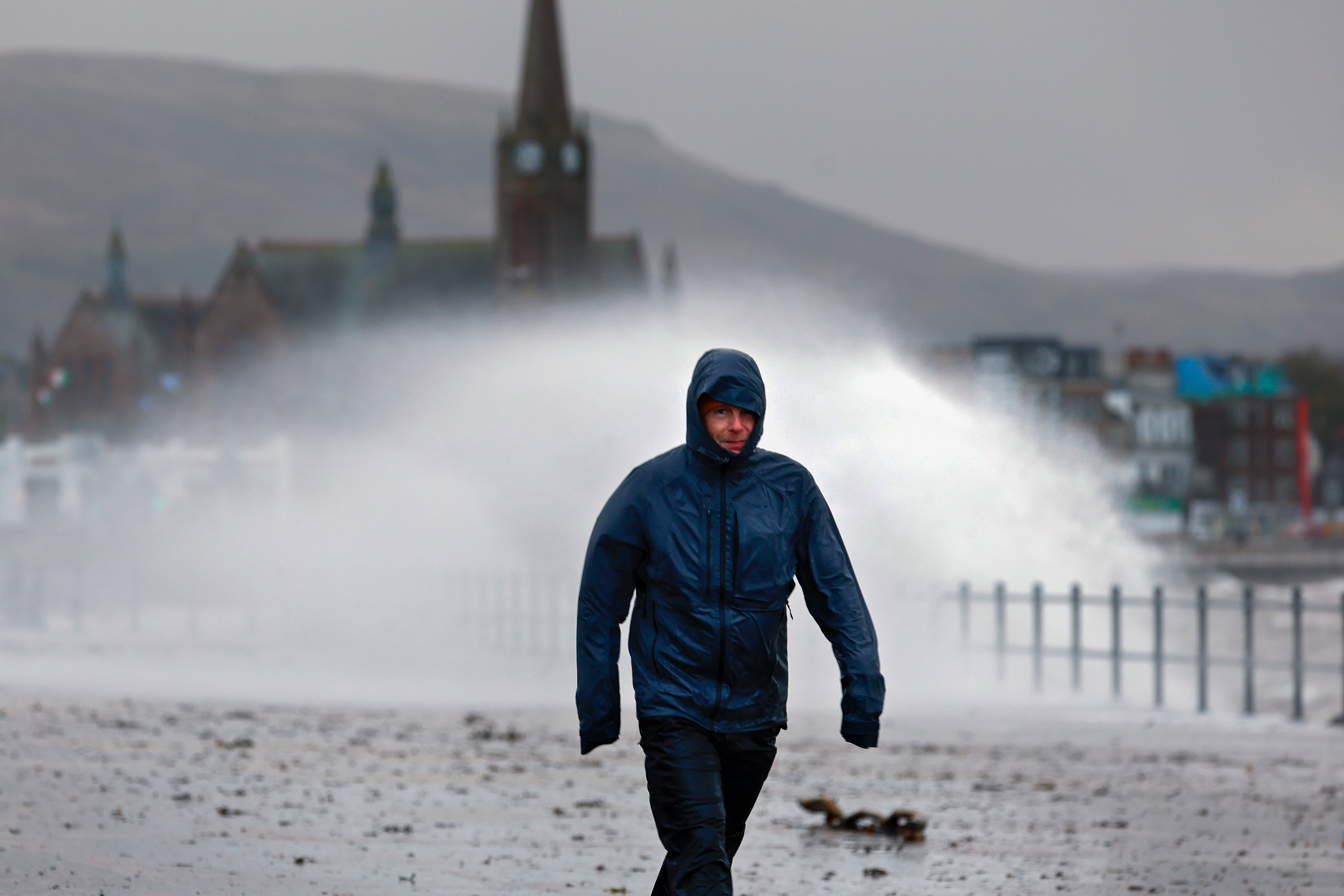 Waves crash over the promenade in Largs