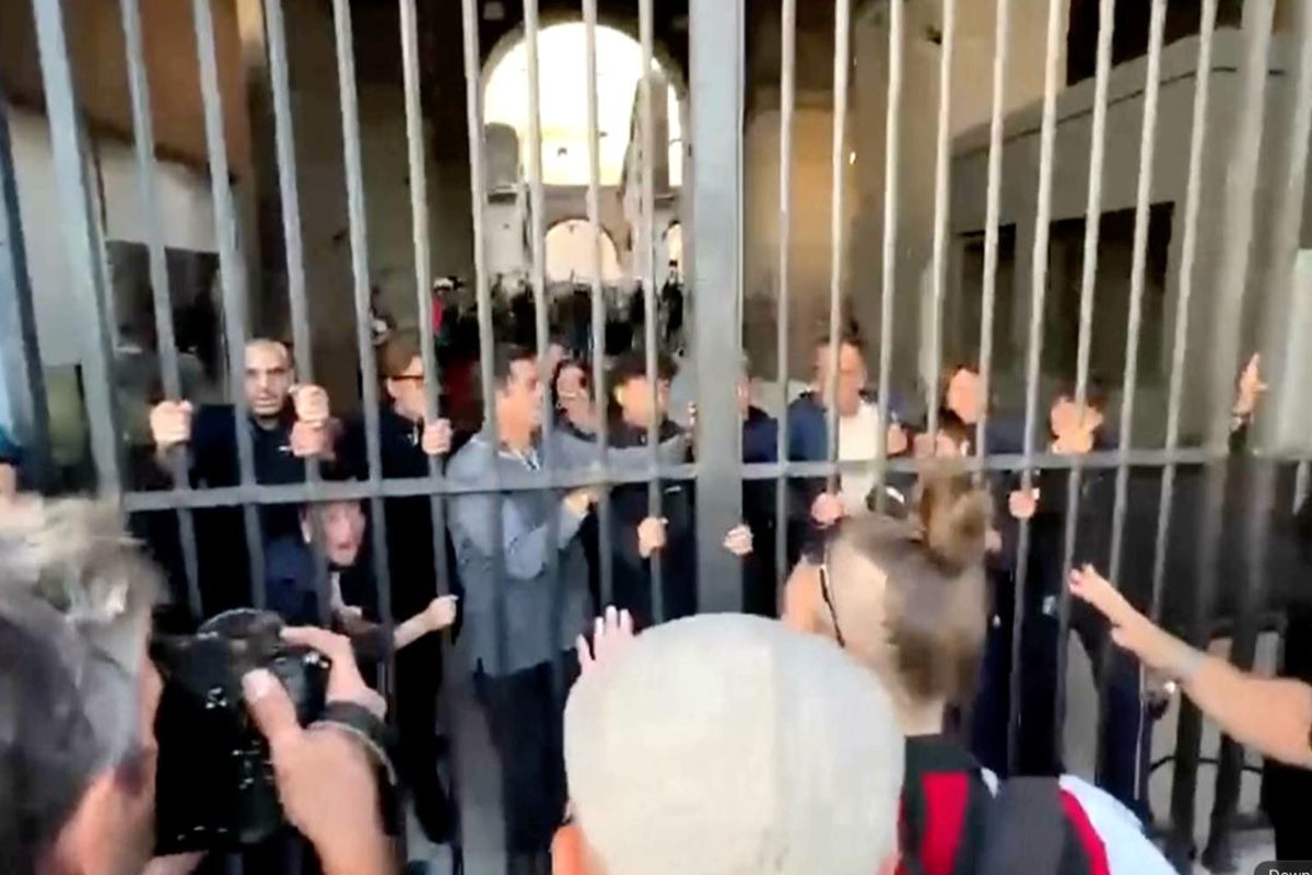 Protesters force their way into the Colosseum in Rome