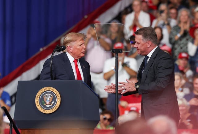 Trump and Gernot Dollner, CEO of Audi AG, attend a rally at Guardian Centers in Perry, Georgia