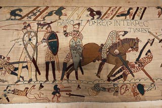The section of the Bayeux Tapestry depicting the โarrow in the eyeโ moment and the death of Harold, on display at the British Museum in London (Jonathan Brady/PA)