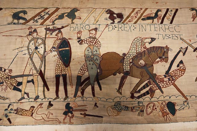The section of the Bayeux Tapestry depicting the ‘arrow in the eye’ moment and the death of Harold, on display at the British Museum in London (Jonathan Brady/PA)