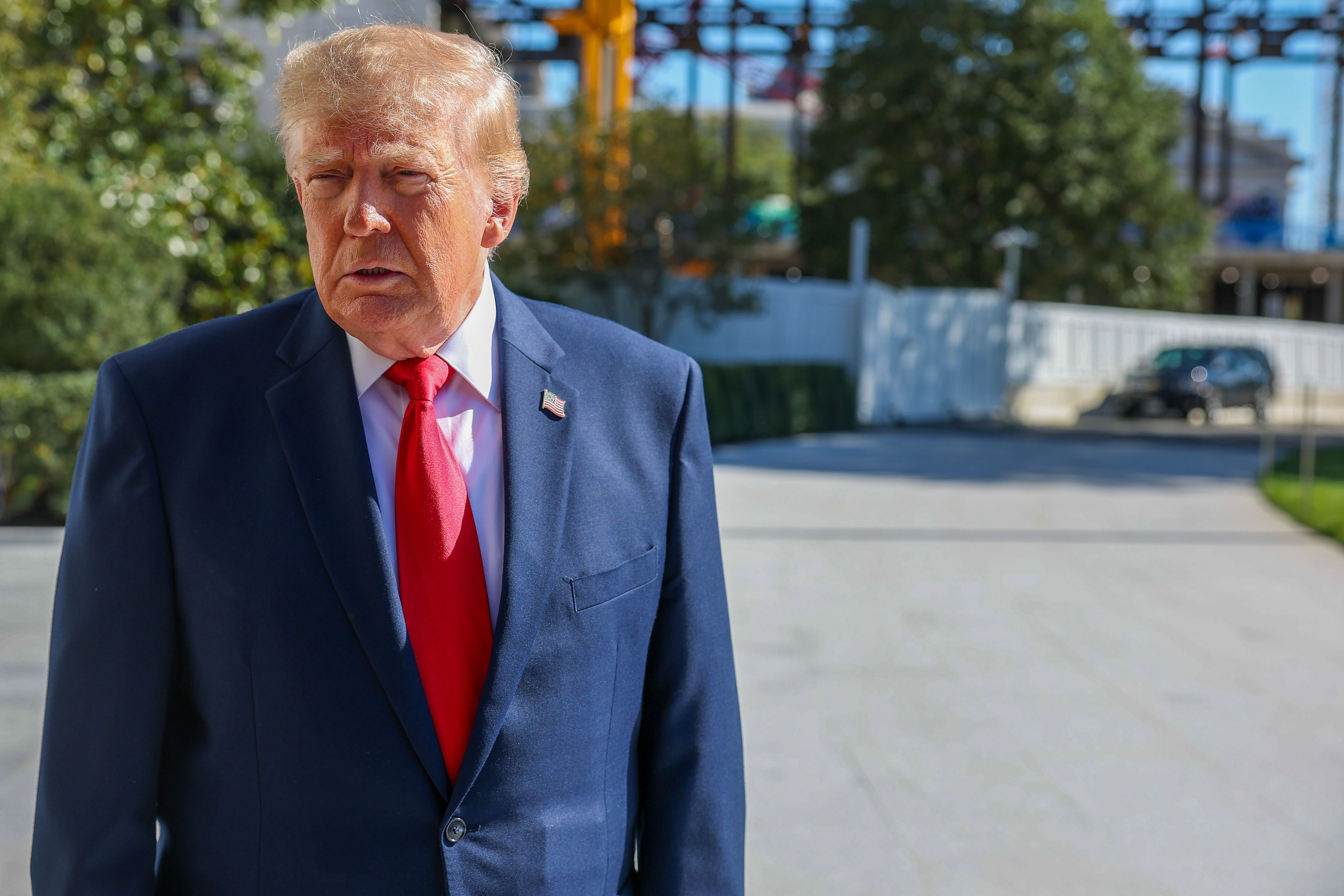 U.S. President Donald Trump stops and speaks to the media before boarding Marine One on the south lawn of the White House on October 25, 2026 in Washington, DC