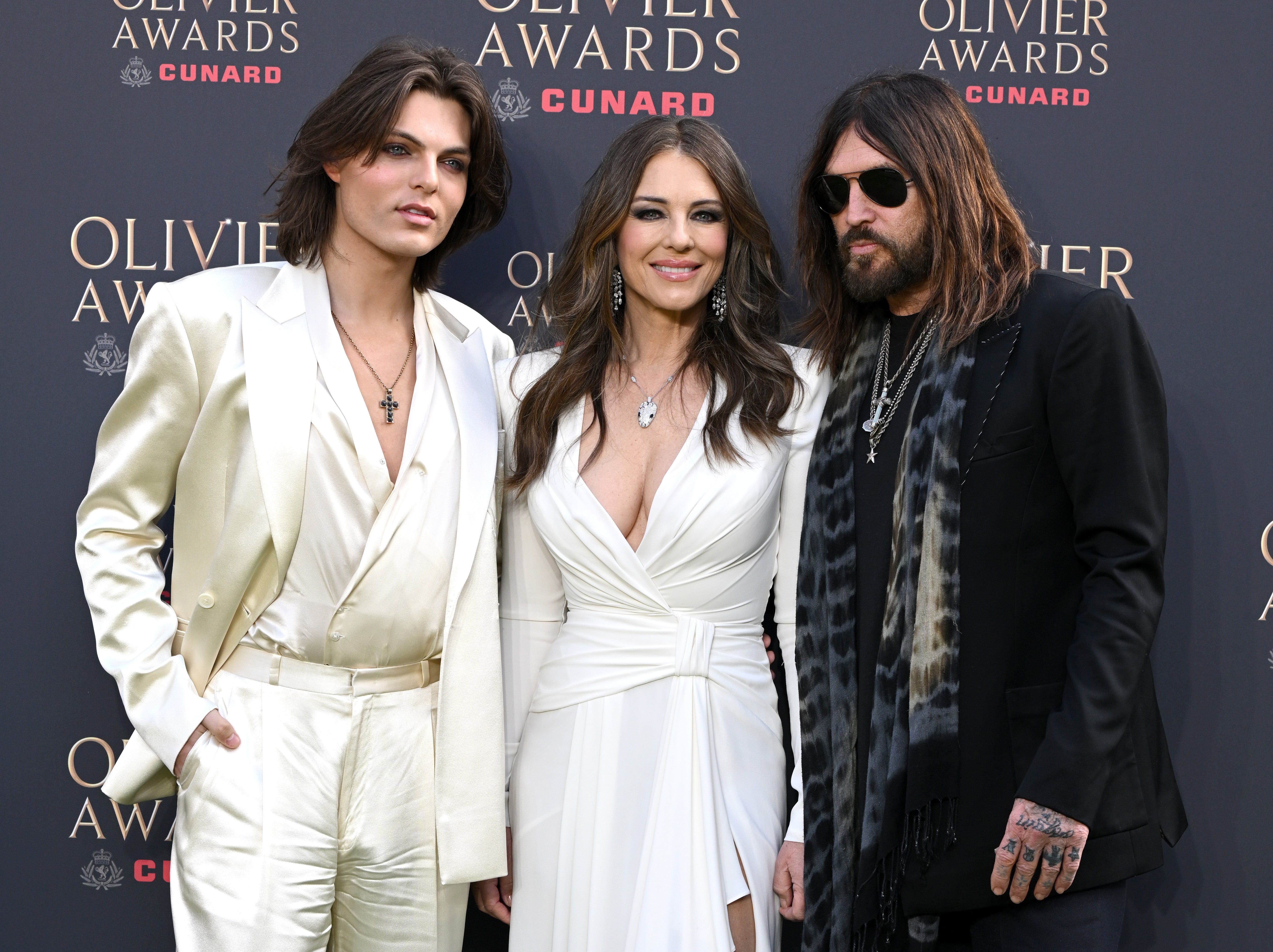 Damian Hurley, Elizabeth Hurley and Billy Ray Cyrus attending The Olivier Awards 2026 in London