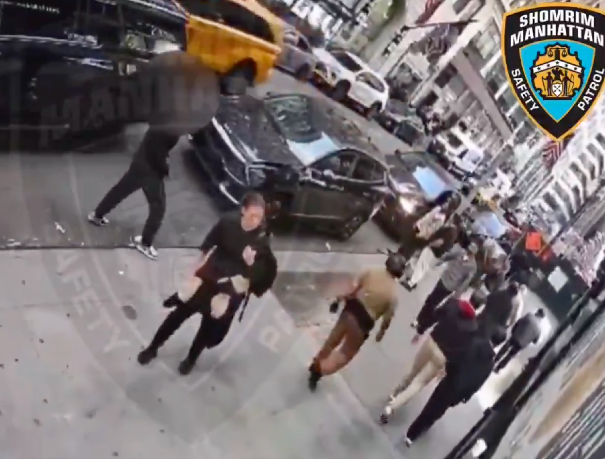 A woman is seen loitering in the street moments before the attack