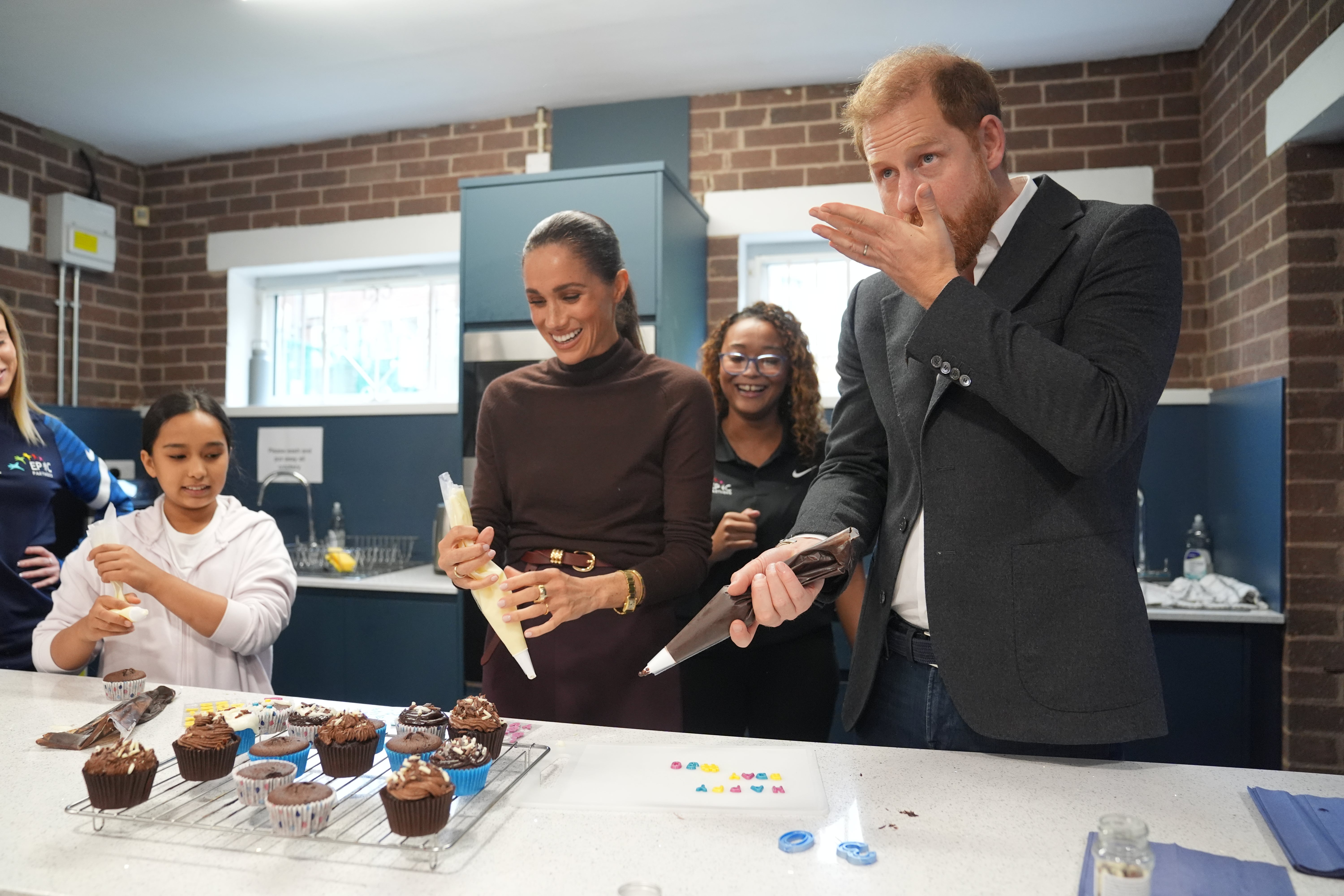 Meghan with her husband Prince Harry at their first public outing, in Nottingham after moving back to the UK