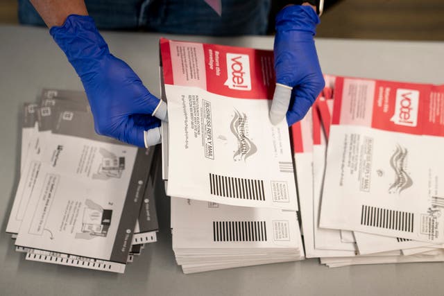An election worker opens voter ballots for the midterm elections at the King County Elections headquarters on October 23, 2026 in Renton, Washington