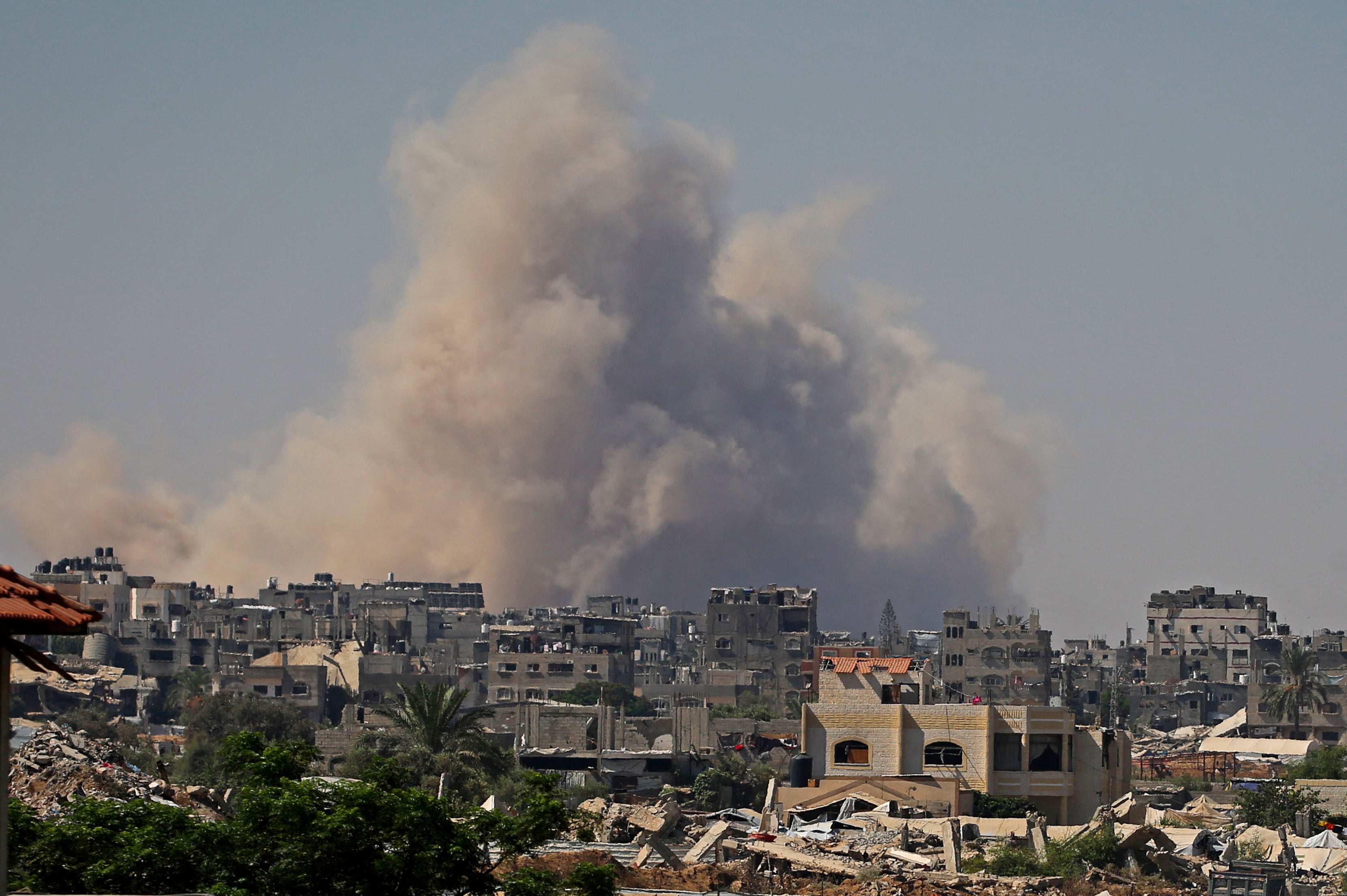 Smoke billows following Israeli demolition of residential structures east of Deir al-Balah on August 26