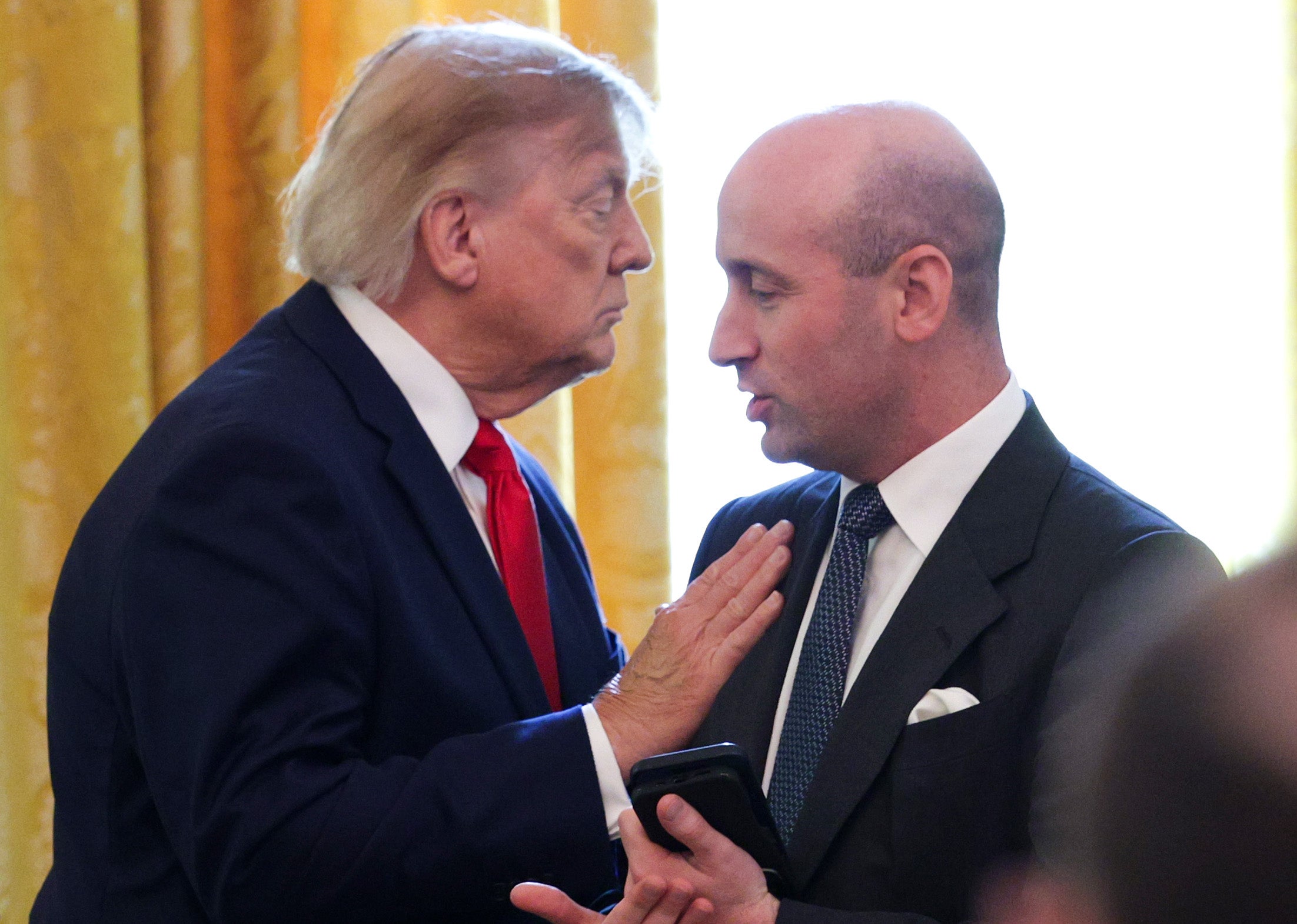 President Trump pictured alongside key advisor Stephen Miller, largely seen as the architect of the administration's immigration policies