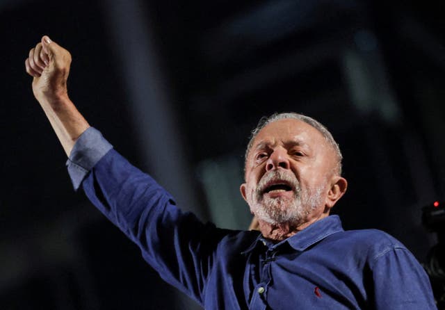 Brazil's President Luiz Inacio Lula da Silva, the Workers' Party (PT) gestures as he addresses supporters after his victory in the presidential runoff election