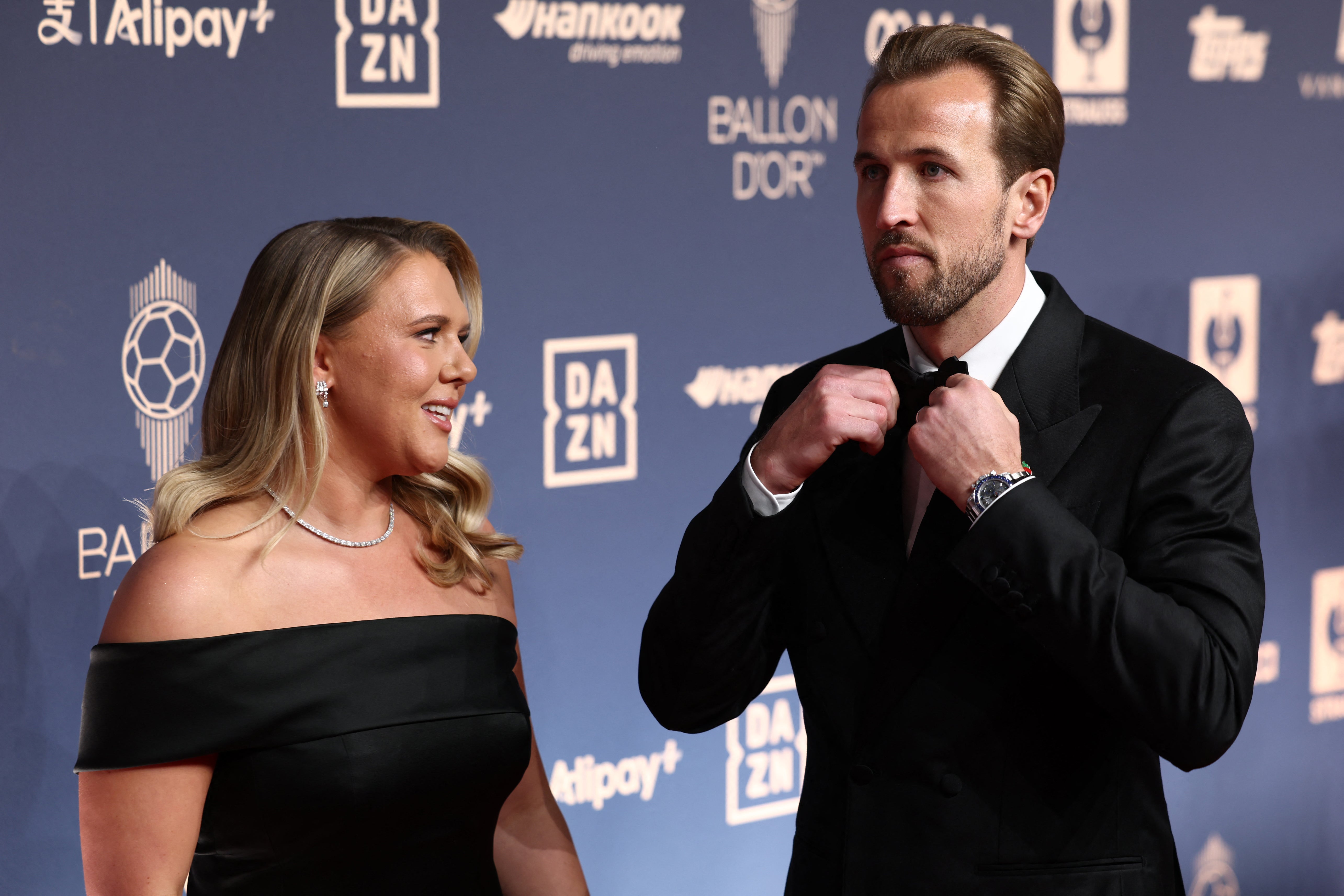 Kane arrives with his wife, Katie Goodland