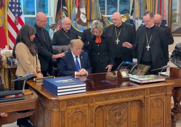 Catholic bishops apologize over photo of them praying with Trump