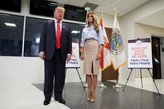 President Donald Trump speaks next to first lady Melania Trump after casting his ballot at the Palm Beach County Supervisor of Elections office, in the 2026 midterm elections in West Palm Beach, Florida, US, October 24, 2026