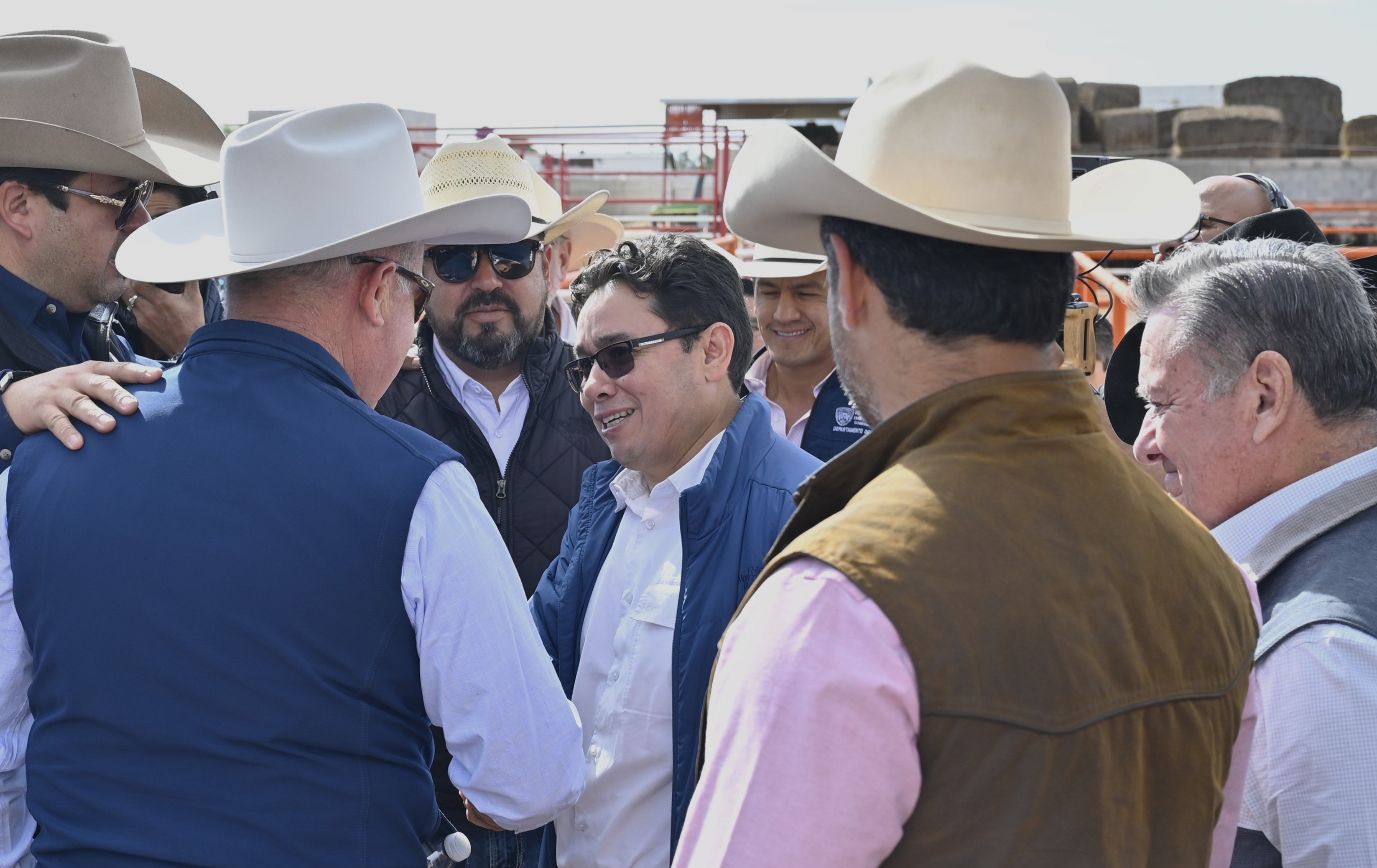 Francisco Javier Calderón Elizalde, center, director-in-chief of Mexico's National Service for Agri-Food Health, Safety and Quality (SENASICA), talks with Mexican and U.S. agriculture officials at the Columbus Stockyards international cattle crossing
