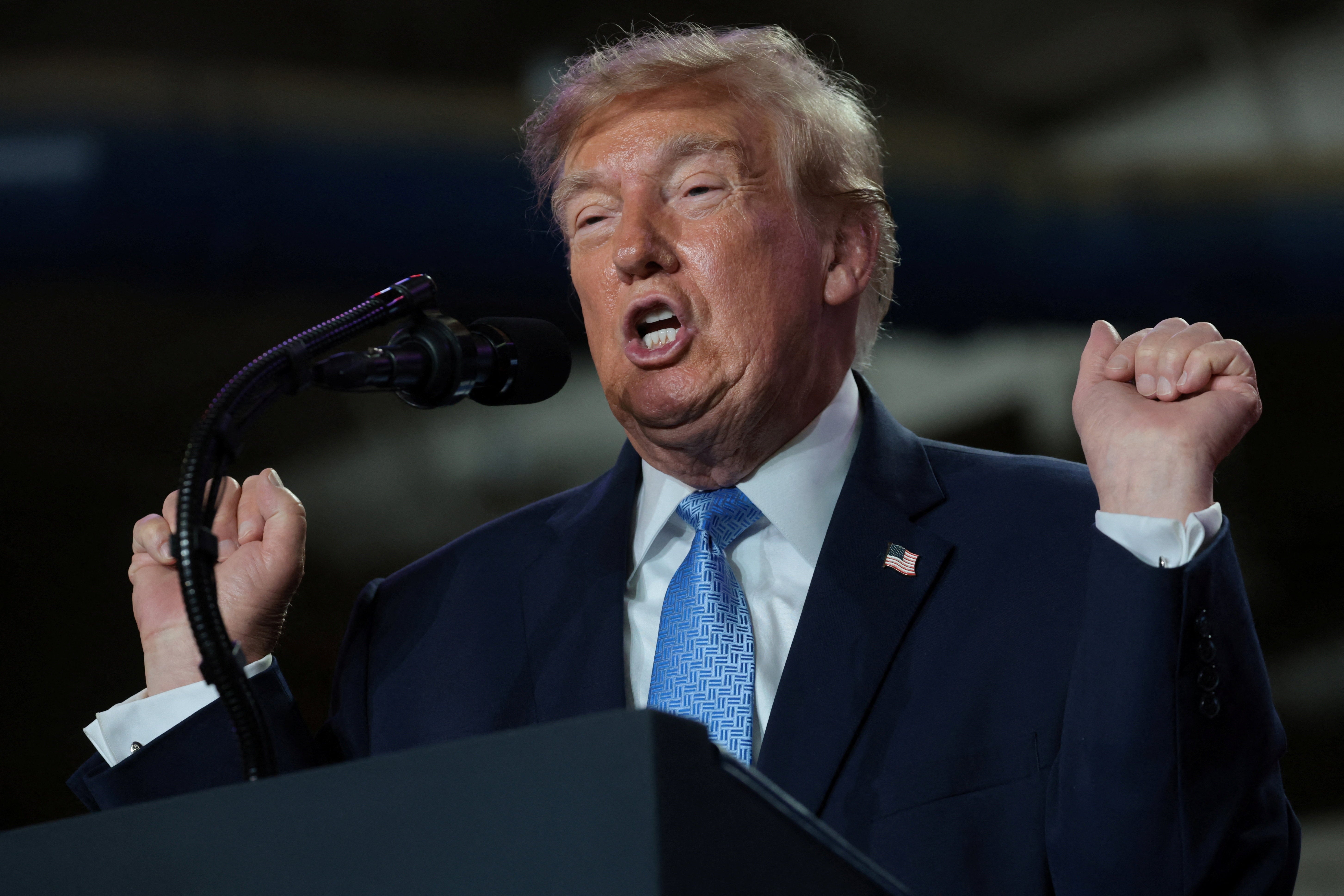 President Donald Trump mocks transgender athletes as he delivers remarks to supporters at a midterm election campaign rally for incumbent US Senator Cindy Hyde-Smith (R-MS) at an arena in Corinth, Mississippi