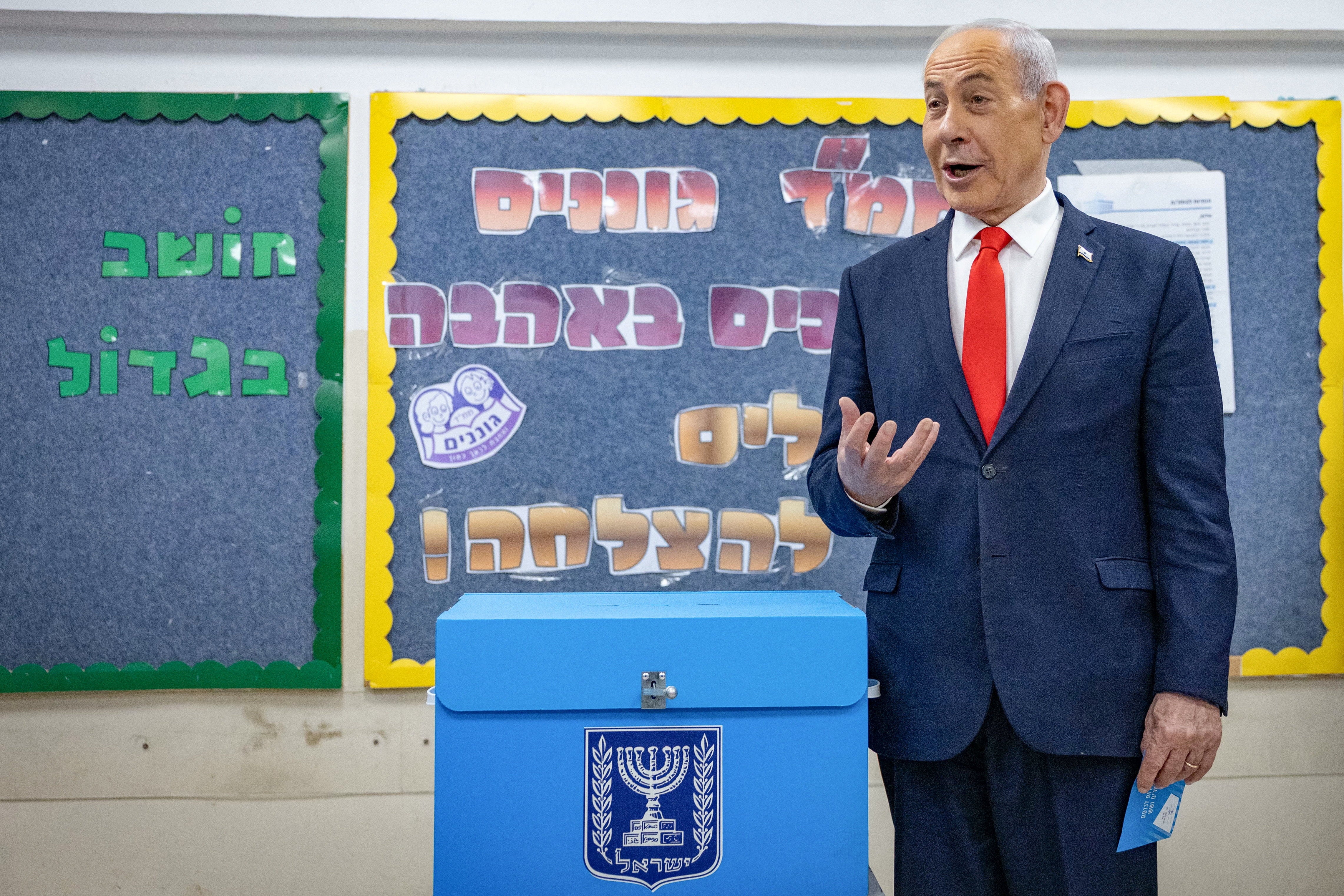 Benjamin Netanyahu turns out to vote at a polling station in Jerusalem on Tuesday