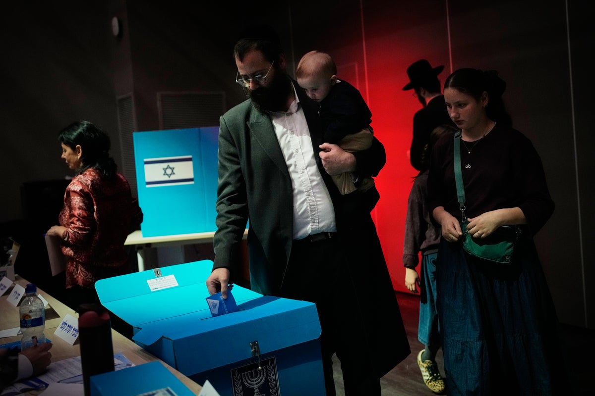 Israelis head to the polls with Netanyahu’s future at stake, in photos