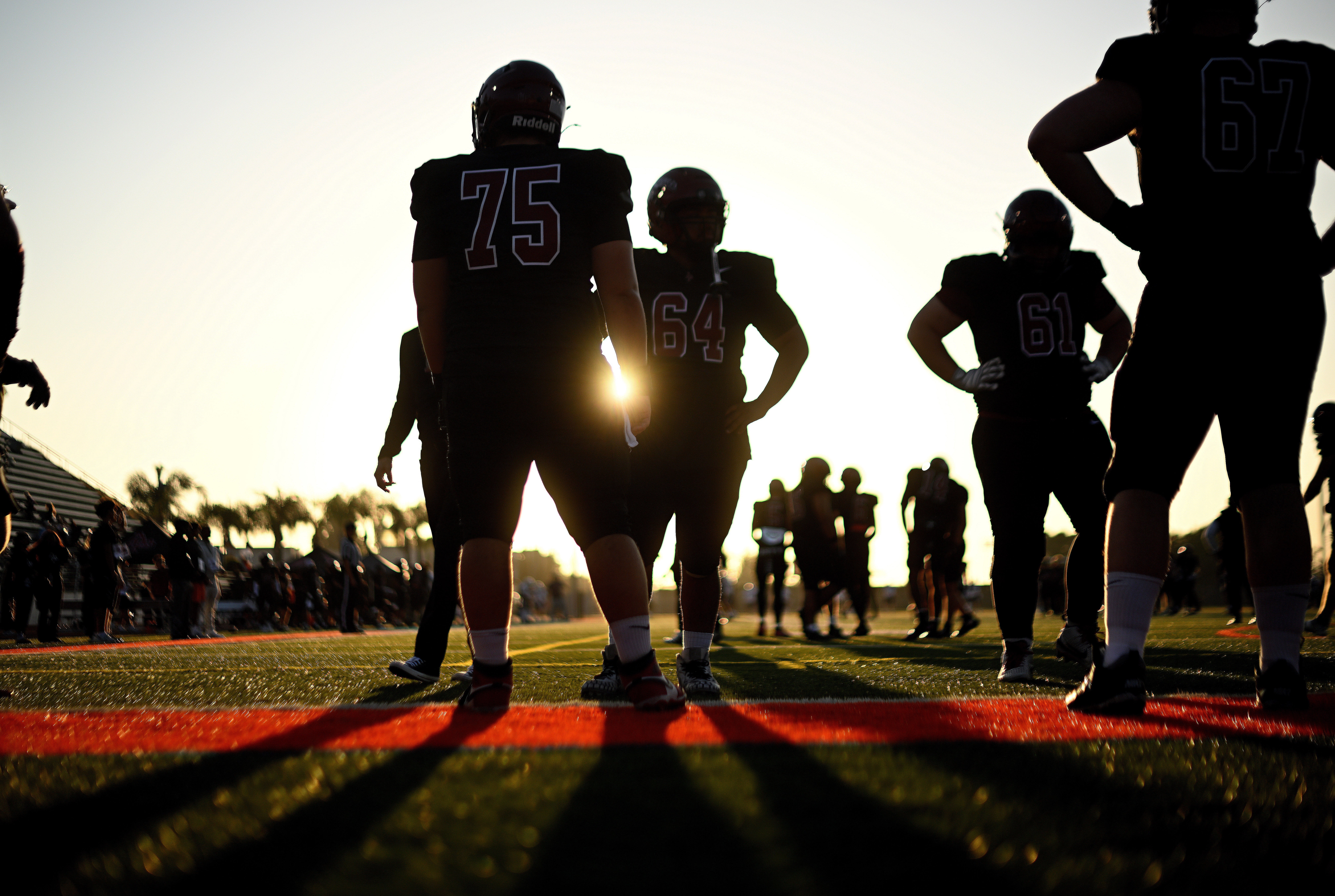 Players from Azusa Pacific warm up before an NCAA Division III college football game against Whittier College, Sept. 19, 2026, in Glendora, Calif.