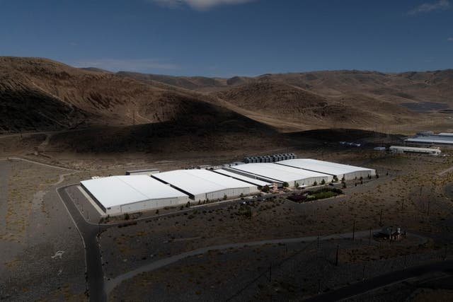 A drone view shows data centers at the Apple Sparks Campus in Sparks, Nevada ( Reuters )
