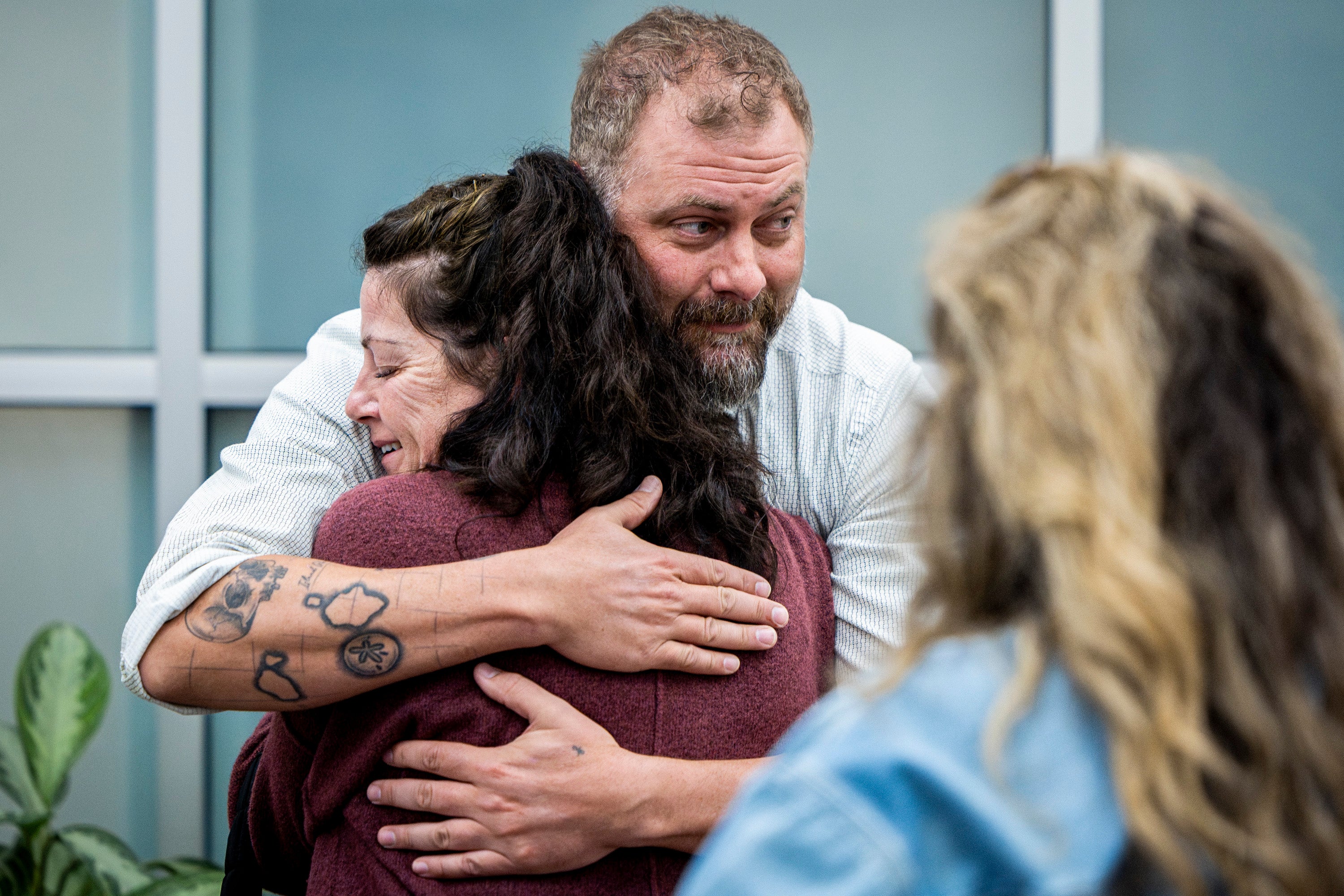 Utah County Sheriff's Deputy Jake Hall hugs Tommi Aime, the youngest sister of Laura Ann Aime, after announcing that definitive evidence linked Ted Bundy to Laura's murder