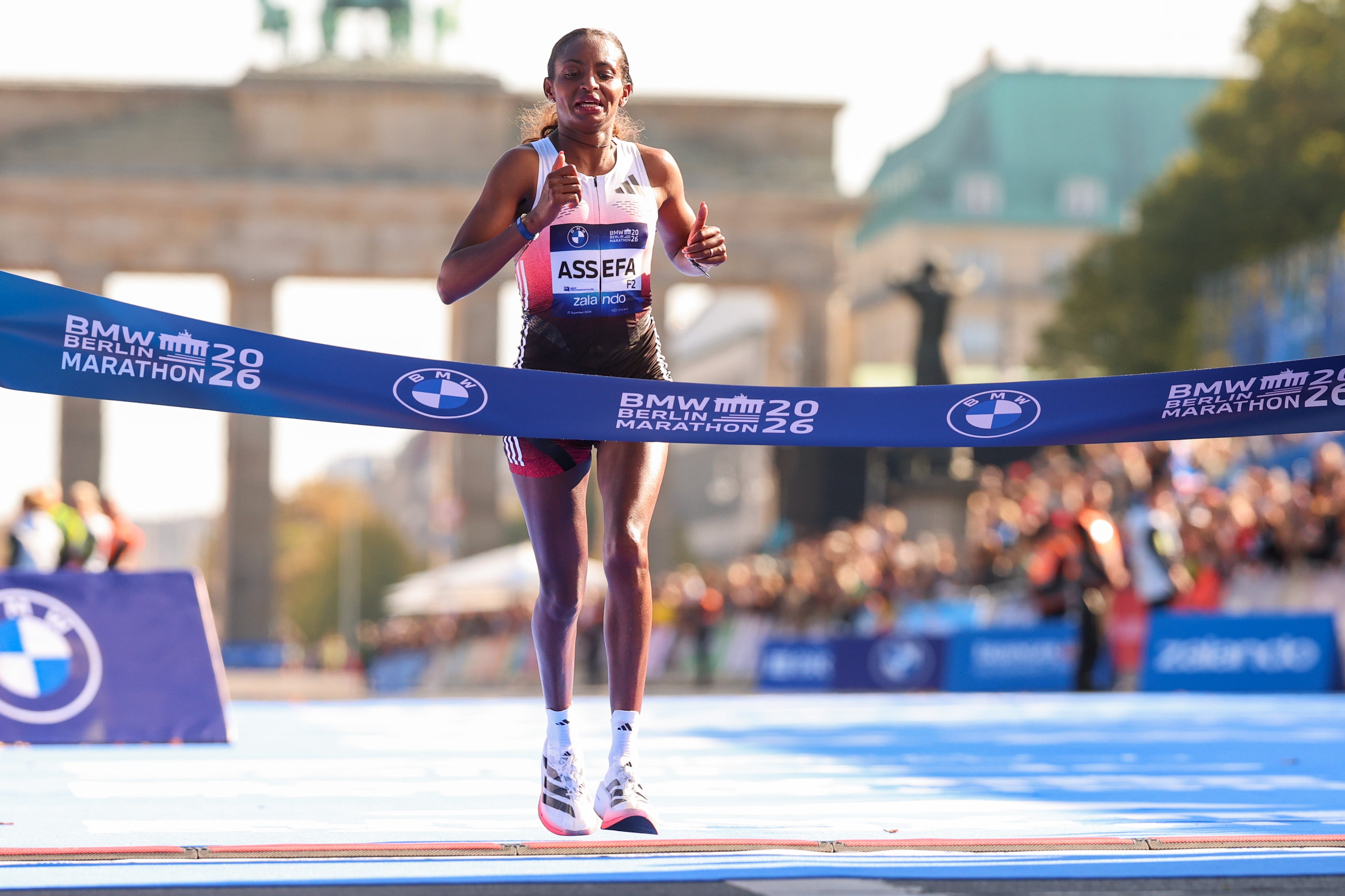 <p>Tigst Assefa fell agonisingly short of a world record in Berlin after a serious Achilles injury in the closing stages</p>