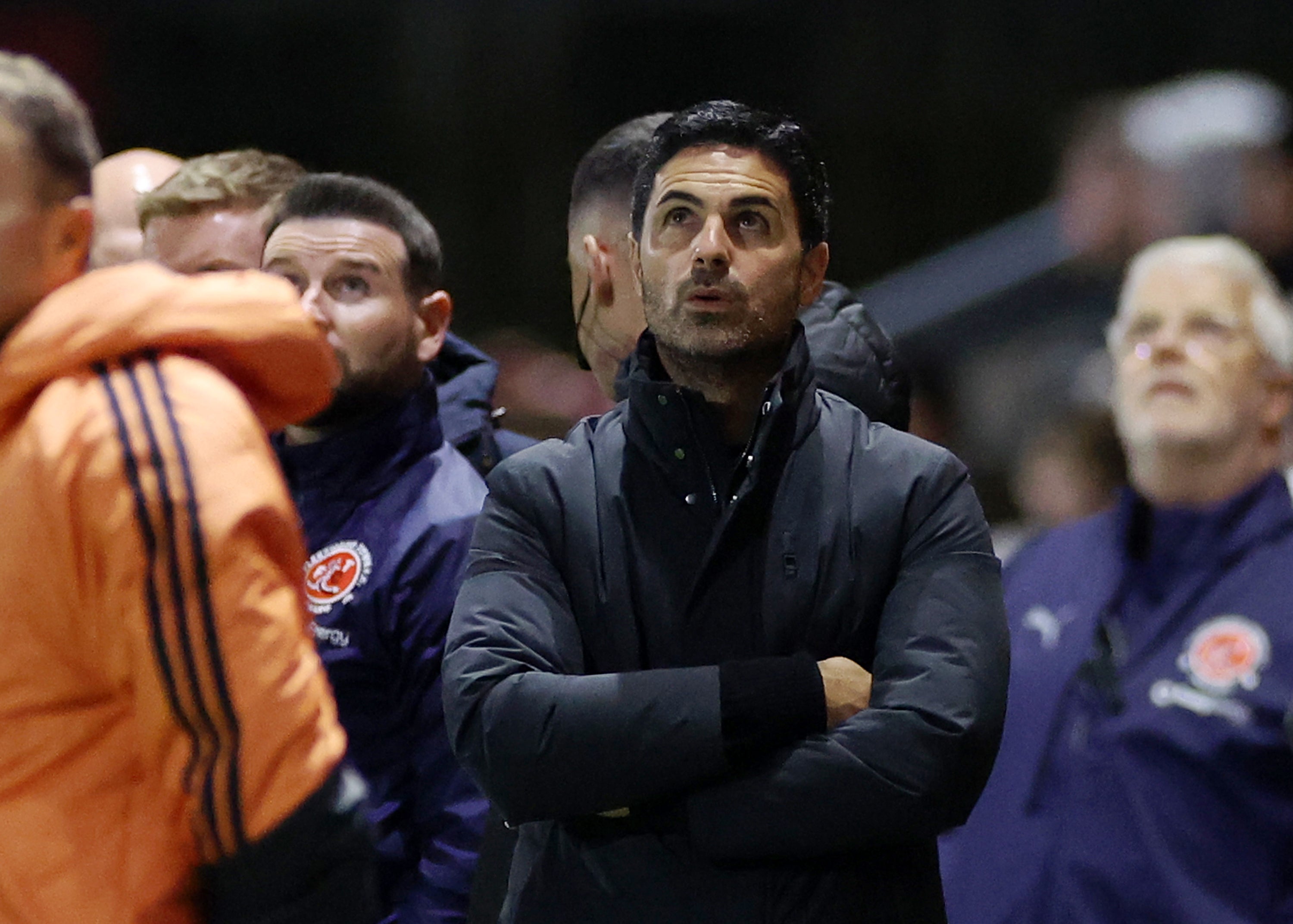 Mikel Arteta, Manager of Arsenal, looks on as a drone pauses the game