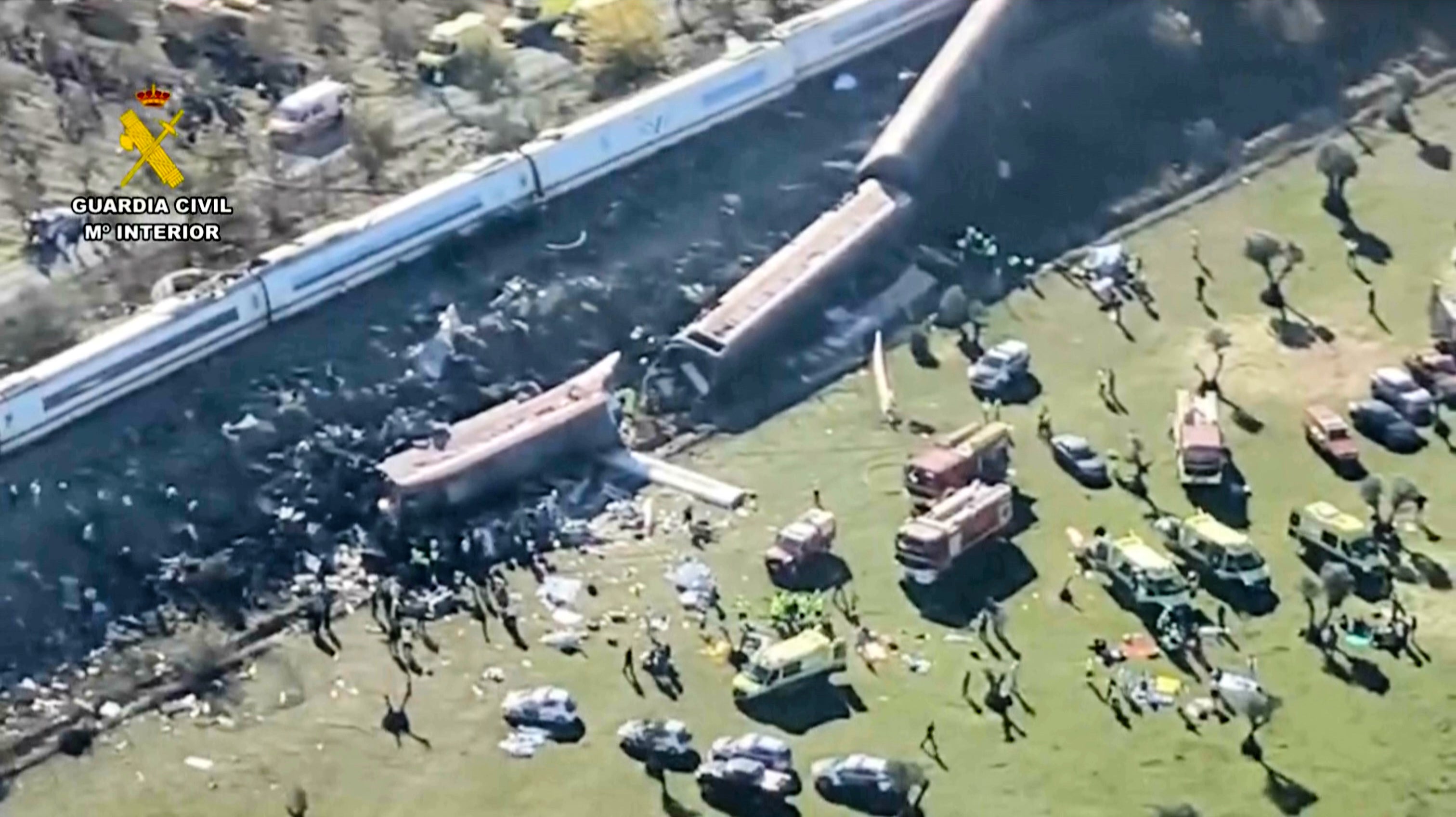 This framegrab taken from a video provided by Guardia Civil shows an aerial view of carriages and first responders on the site