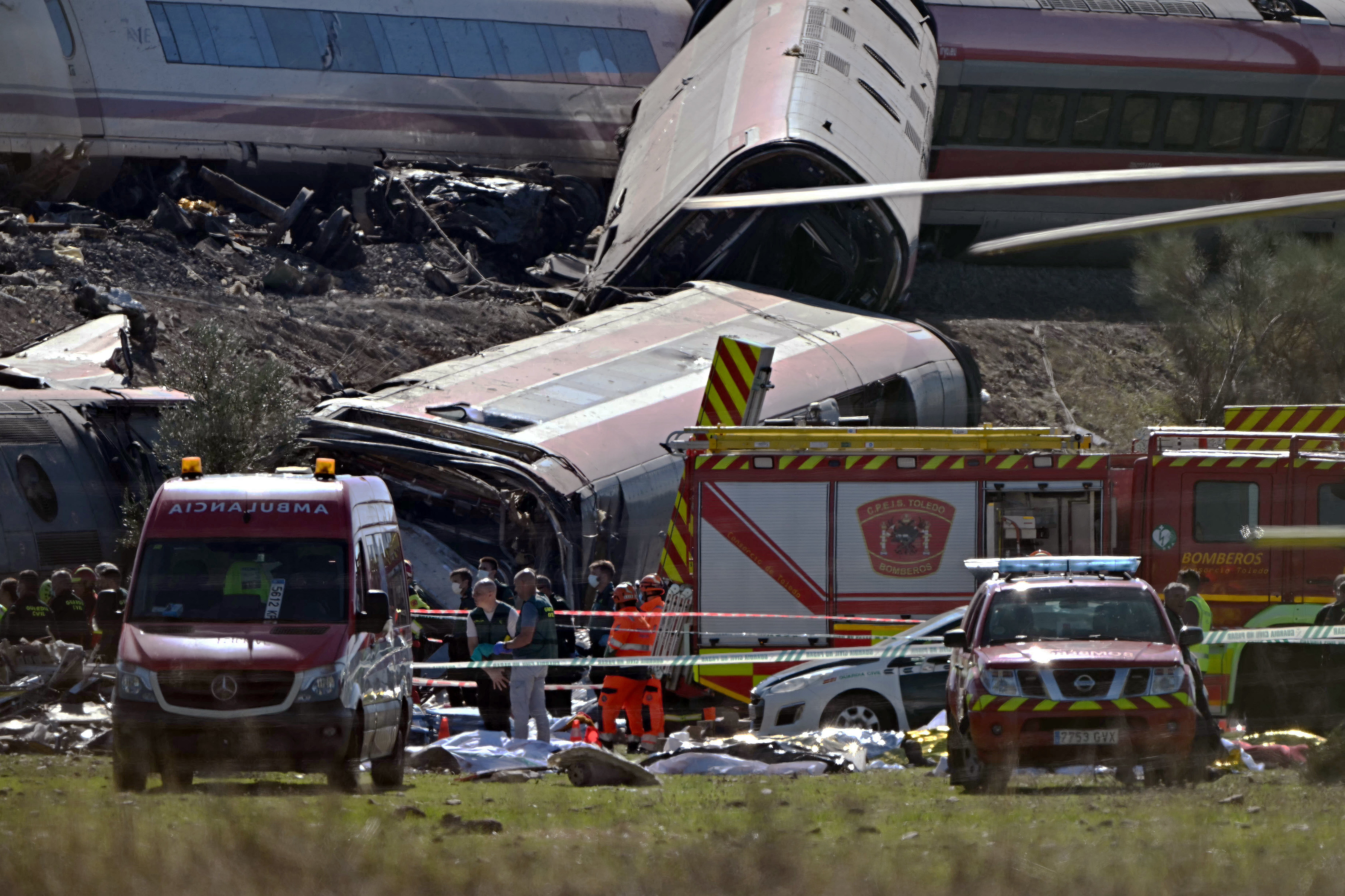 Emergency services working at the site of the collision (AFP/Getty)