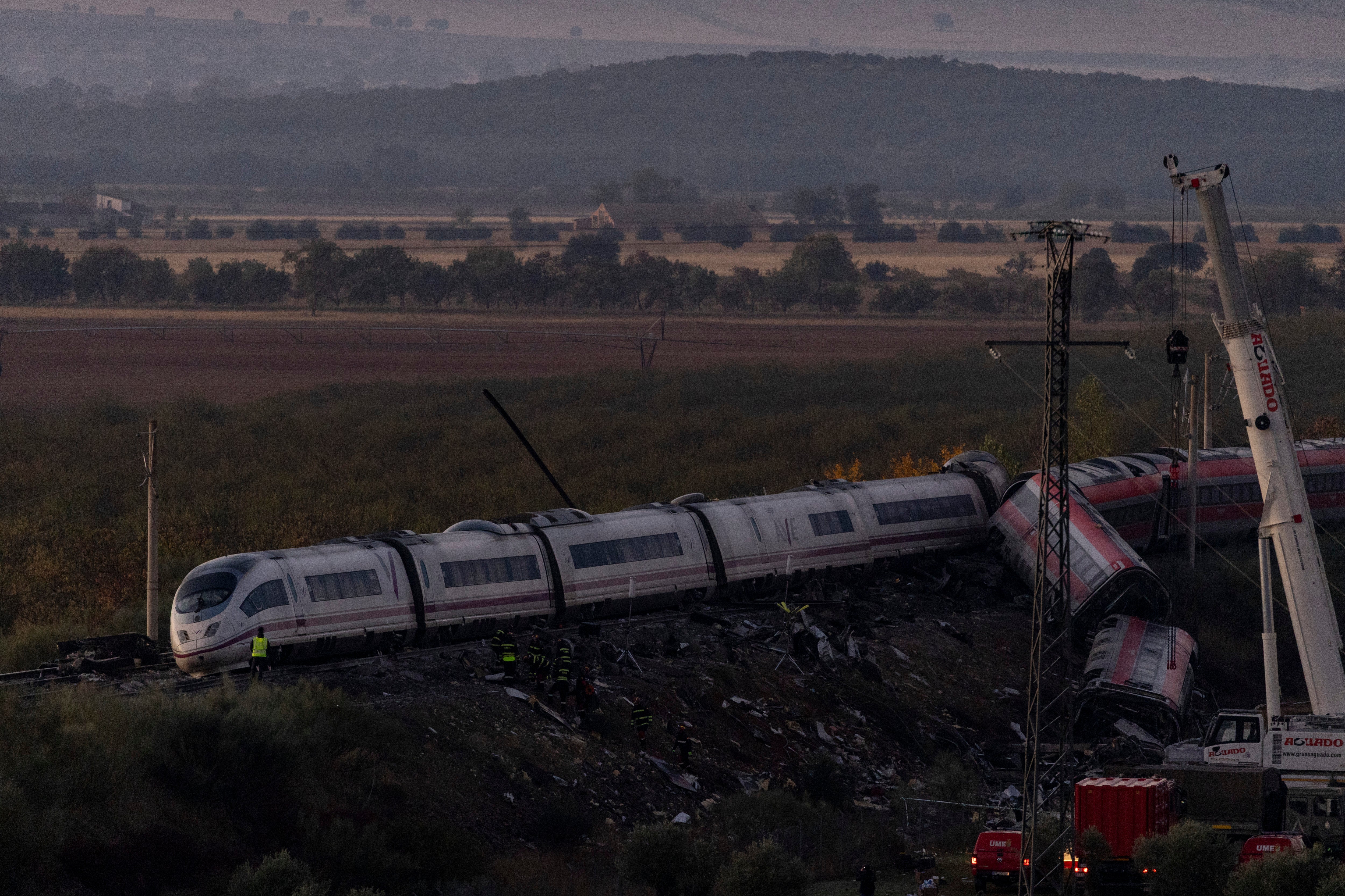 mergency workers gather at the scene of a train crash on October 29, 2026 near Yebenes