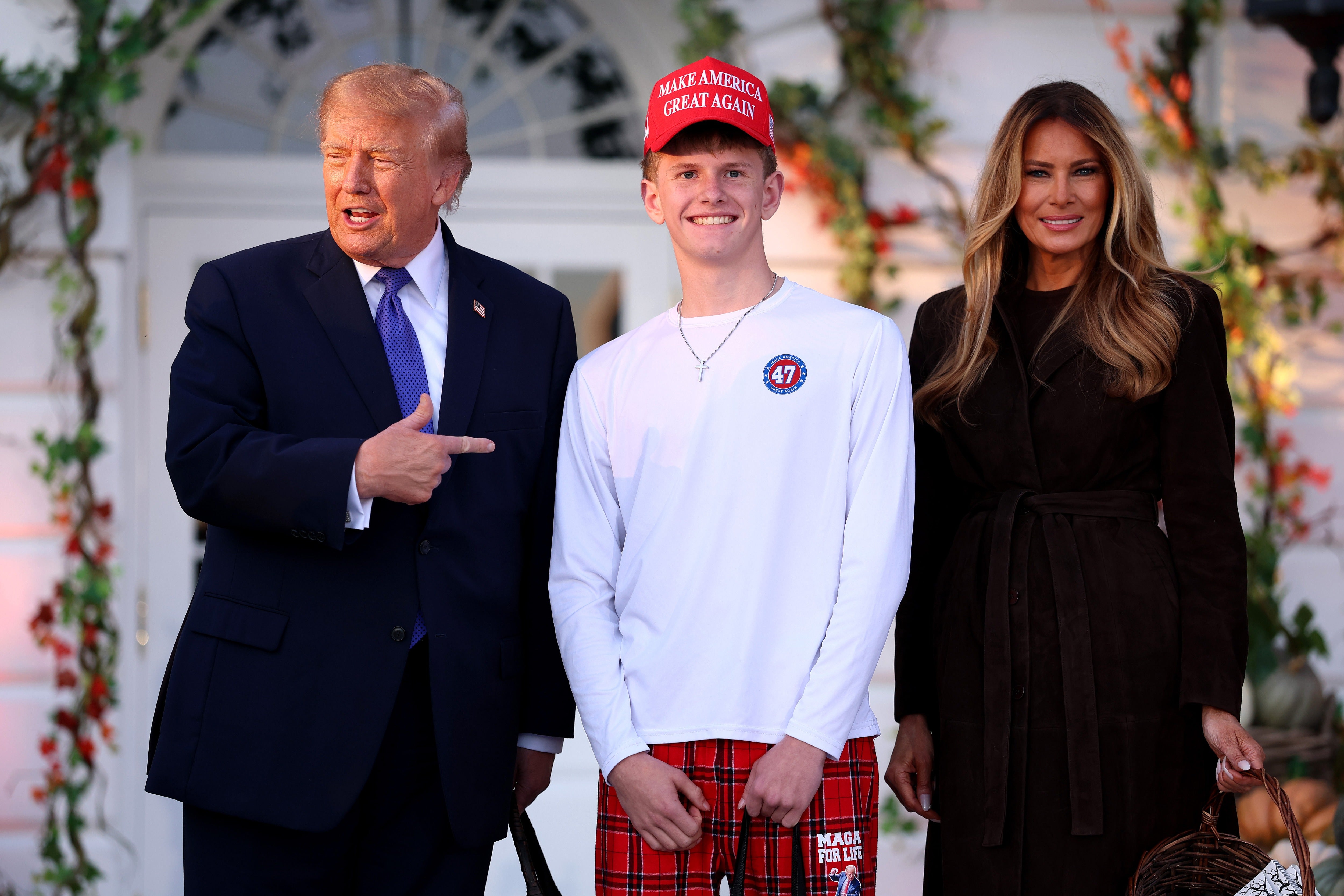 One older kid took a photo with Trump and Melania dressed in a ‘Make America Great Again’ red hat, a white long-sleeve shirt with the number 47 — for the 47th president — on it and red flannel pajama pants with the phrase ‘MAGA for life.’