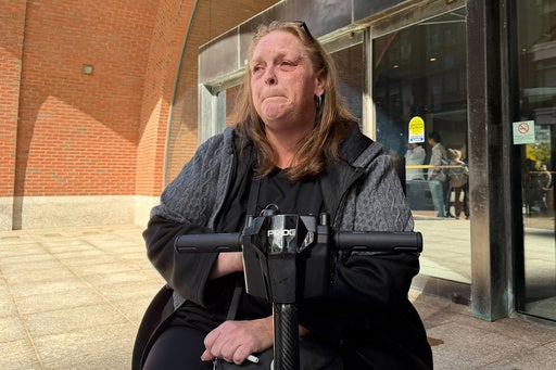 Jean Falletti, friend of Sandra Birchmore, talks to reporters after the start of the trial of former police officer Matthew Farwell, who is accused of killing Birchmore, outside federal court Friday, Oct. 9, 2026