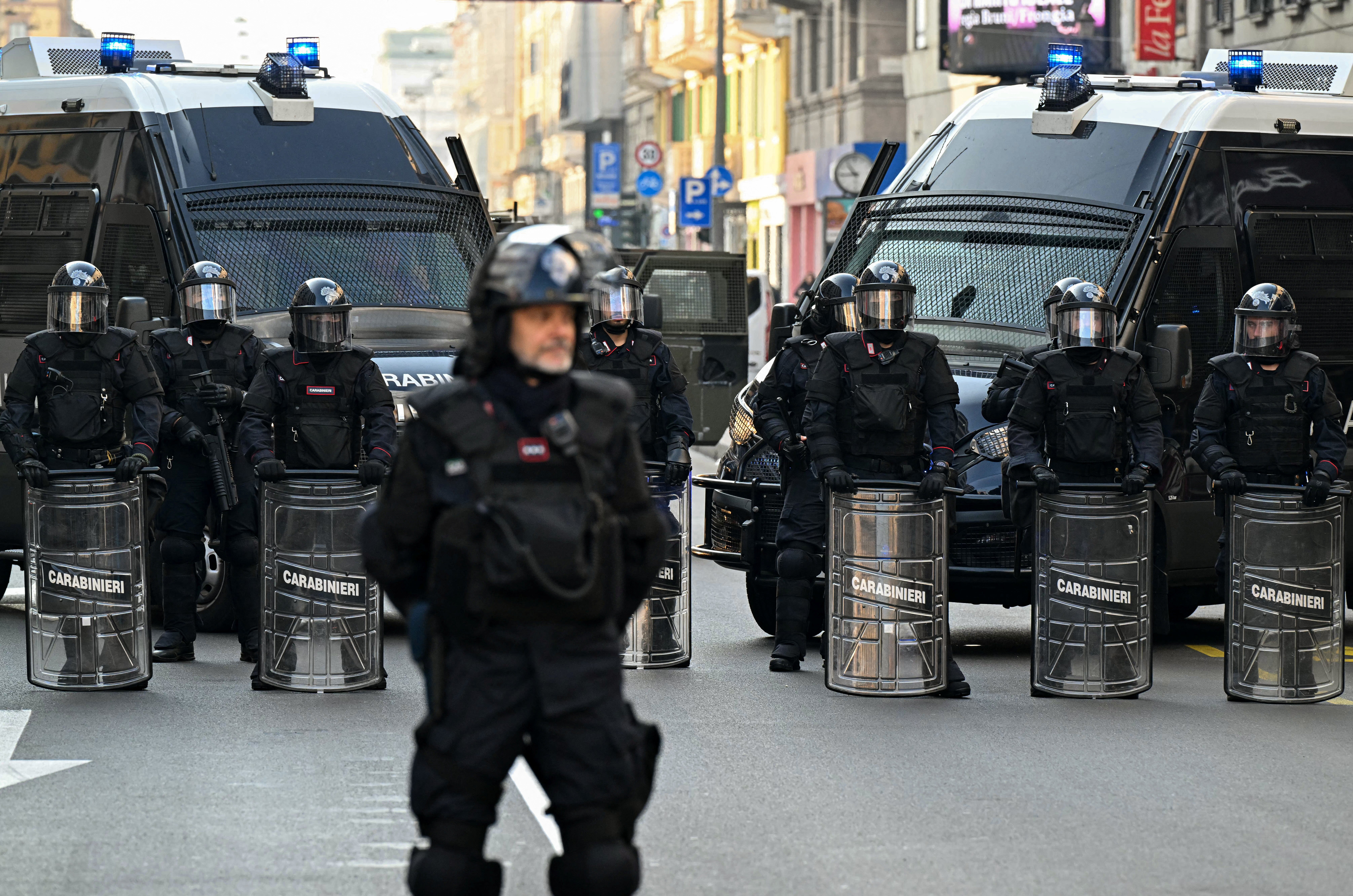 Italy's military police Carabinieri secure a street in Milan on Friday