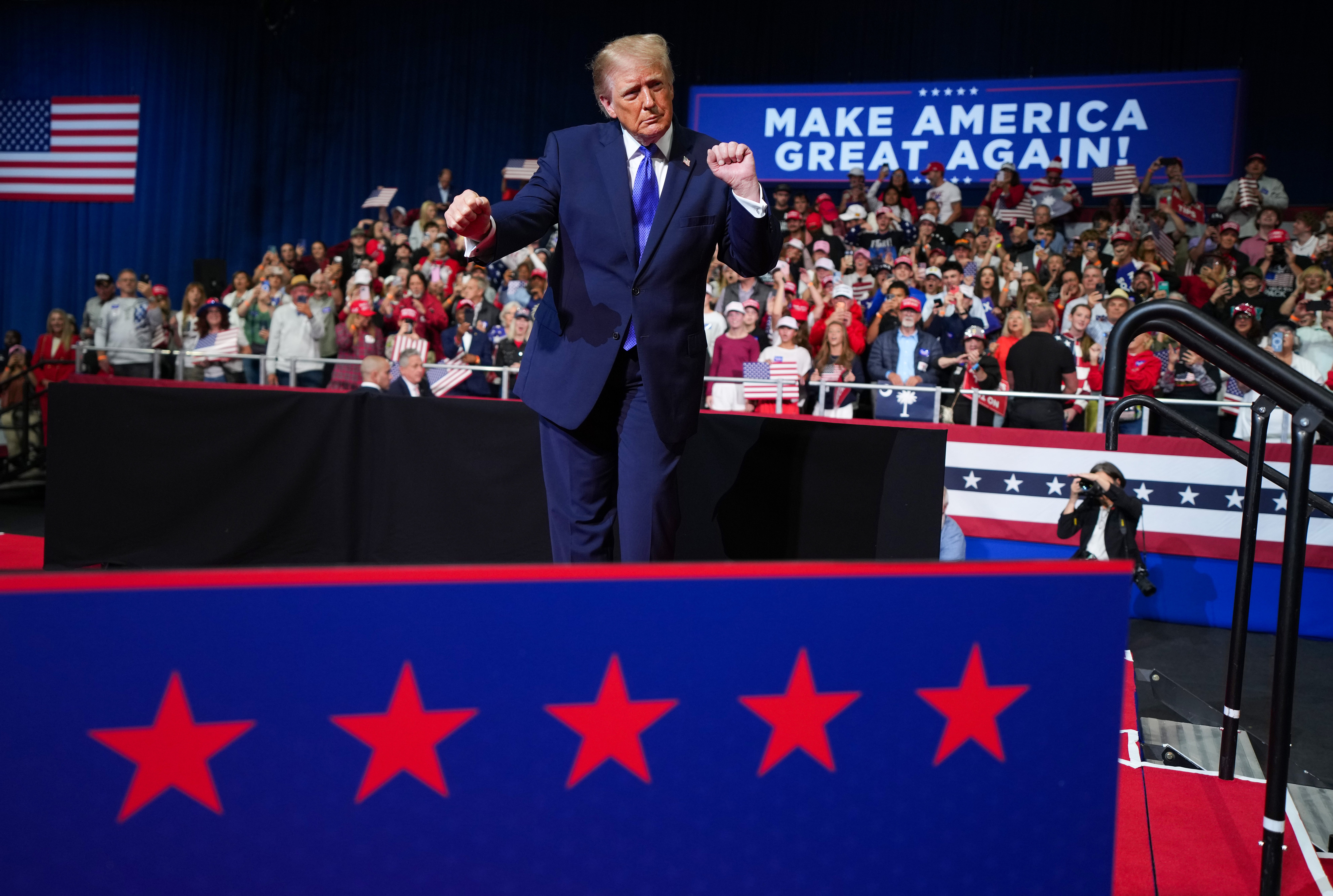 President Donald Trump has reversed course and will now hold midterm rallies in Kansas and Iowa this weekend after he was called out by a reporter for canceling them, according to reports