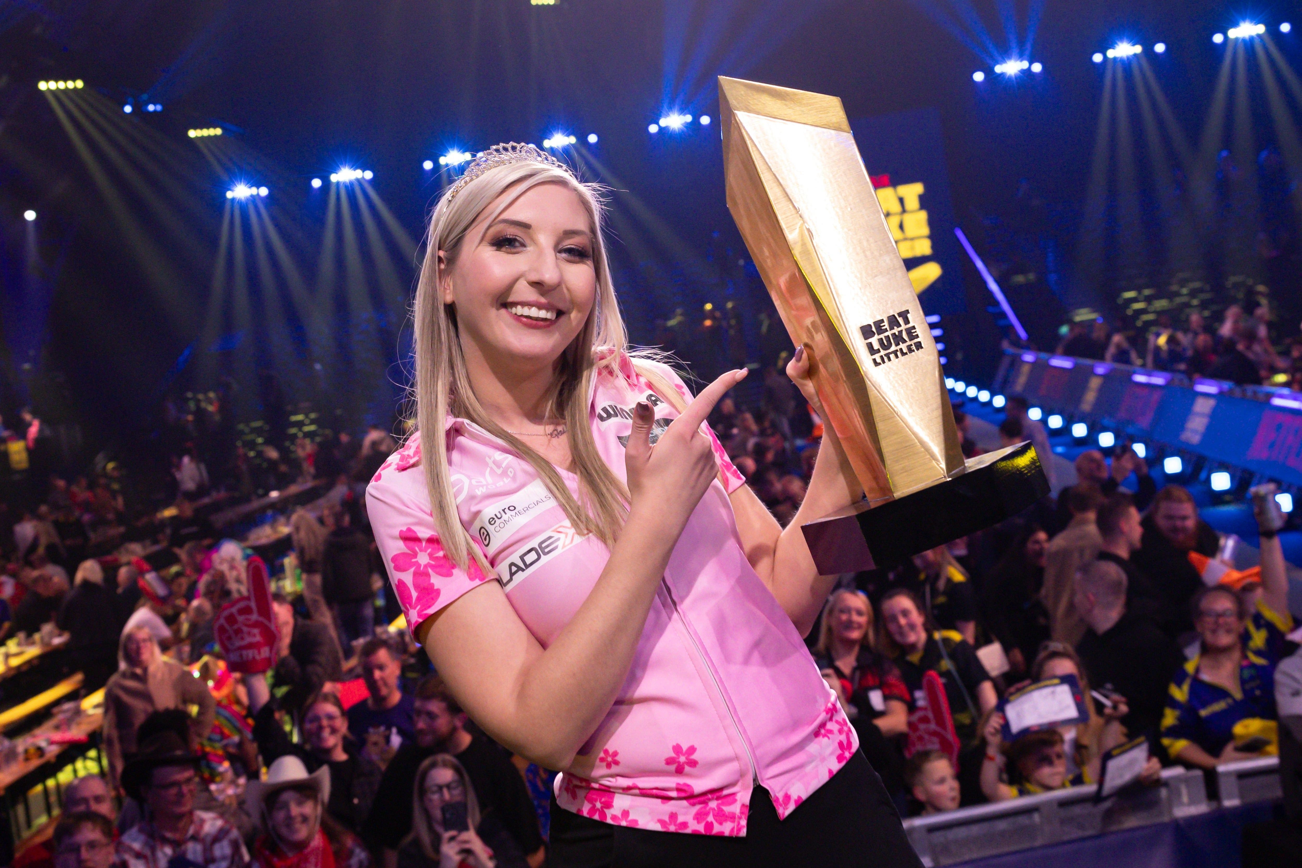 Fallon Sherrock with the 'I Beat Luke Littler' trophy