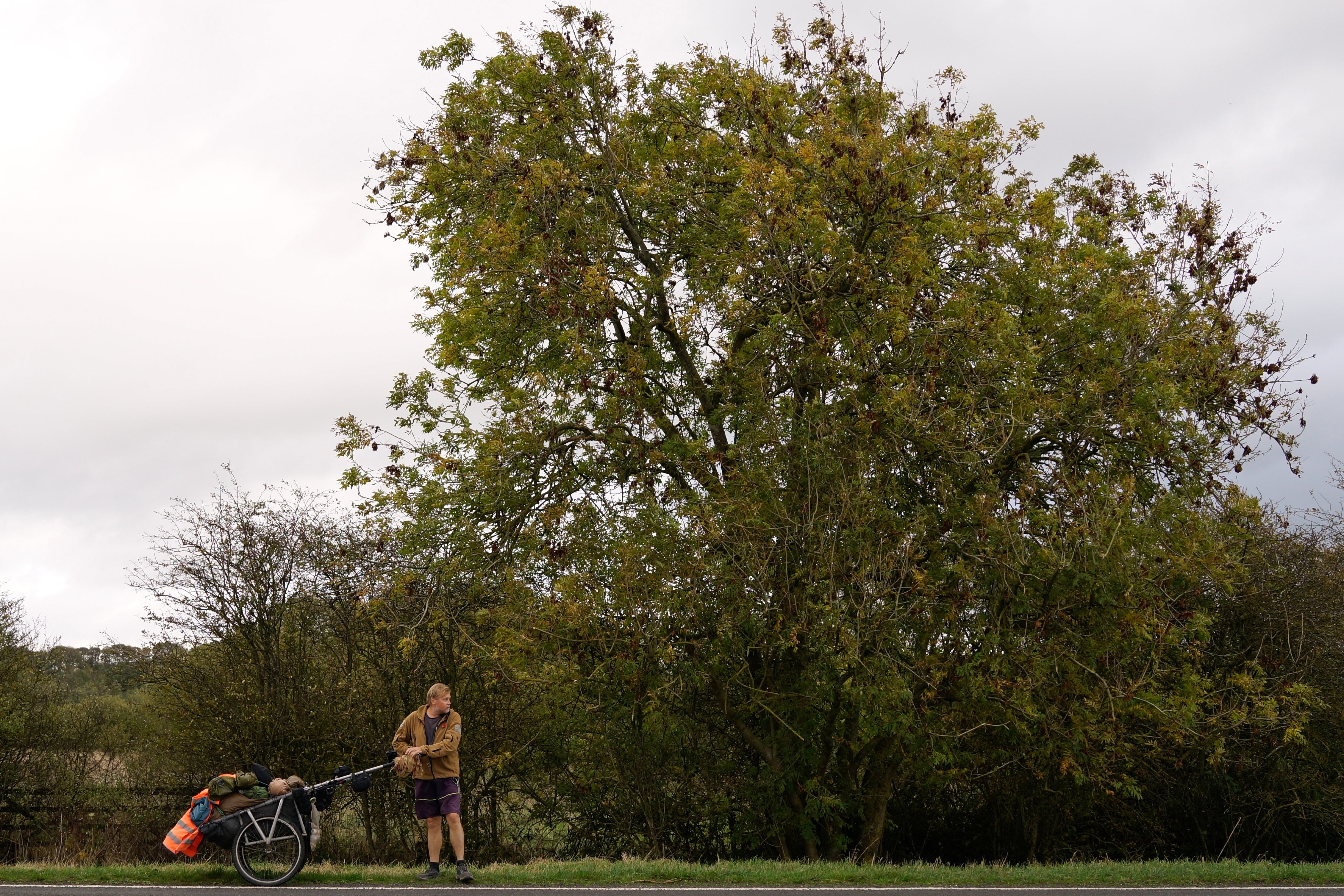 British adventurer Karl Bushby walks near Market Rasen, Lincolnshire, England, Wednesday, Oct. 28, 2026, on the final stretch of his 28-year walk around the world to get back to his mother's home in Hull. (AP Photo/Brian Melley)