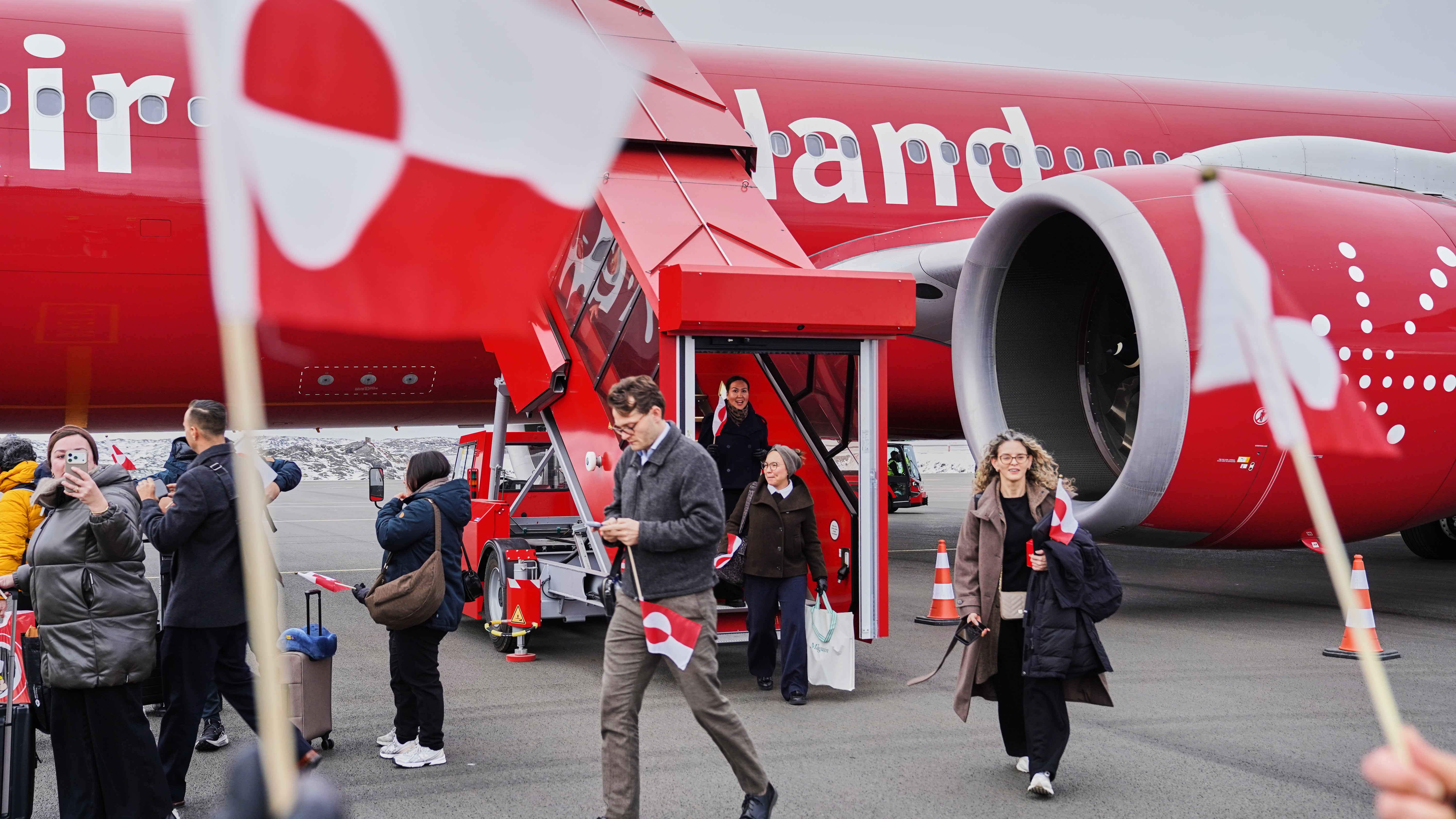 Passengers disembark an Air Greenland A330neo, after completing the first-ever direct flight from Copenhagen to Ilulissat, in Ilulissat, Greenland Thursday, Oct. 29, 2026. (AP Photo/James Brooks)