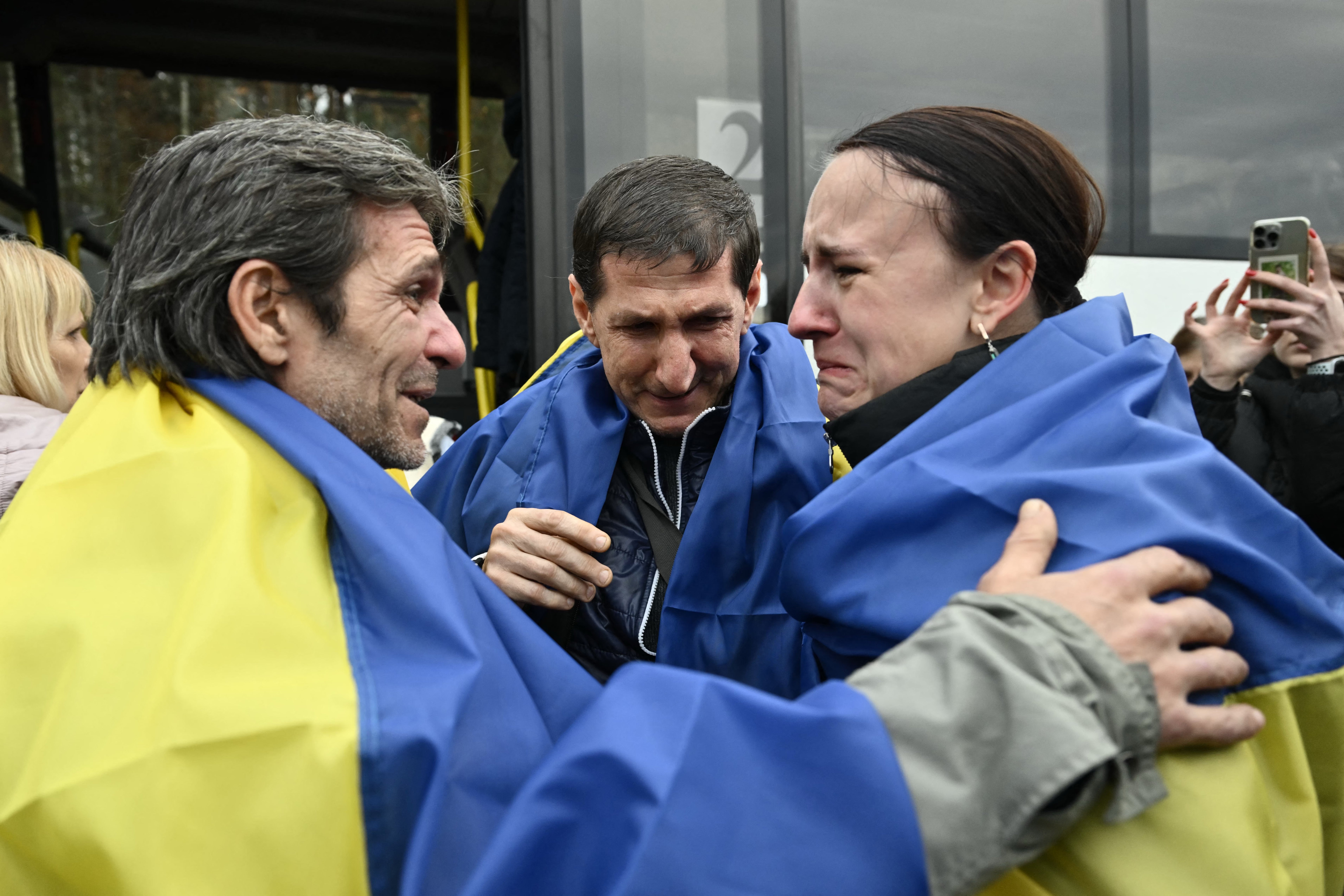 Residents evacuated from the Russian-controlled city of Oleshky during a humanitarian mission