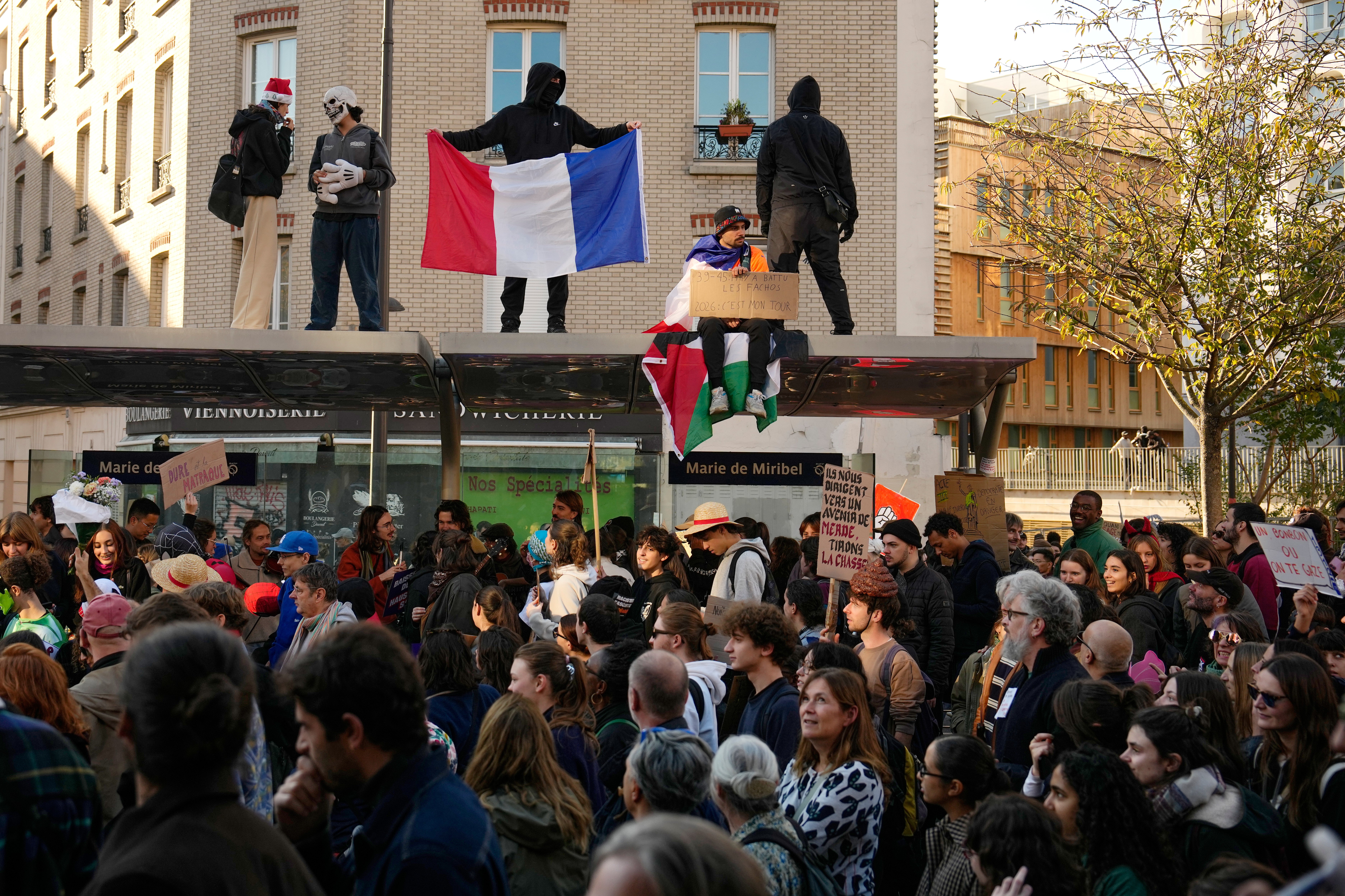 People attend protests over living costs and education in Paris, France, Saturday, Oct. 31, 2026