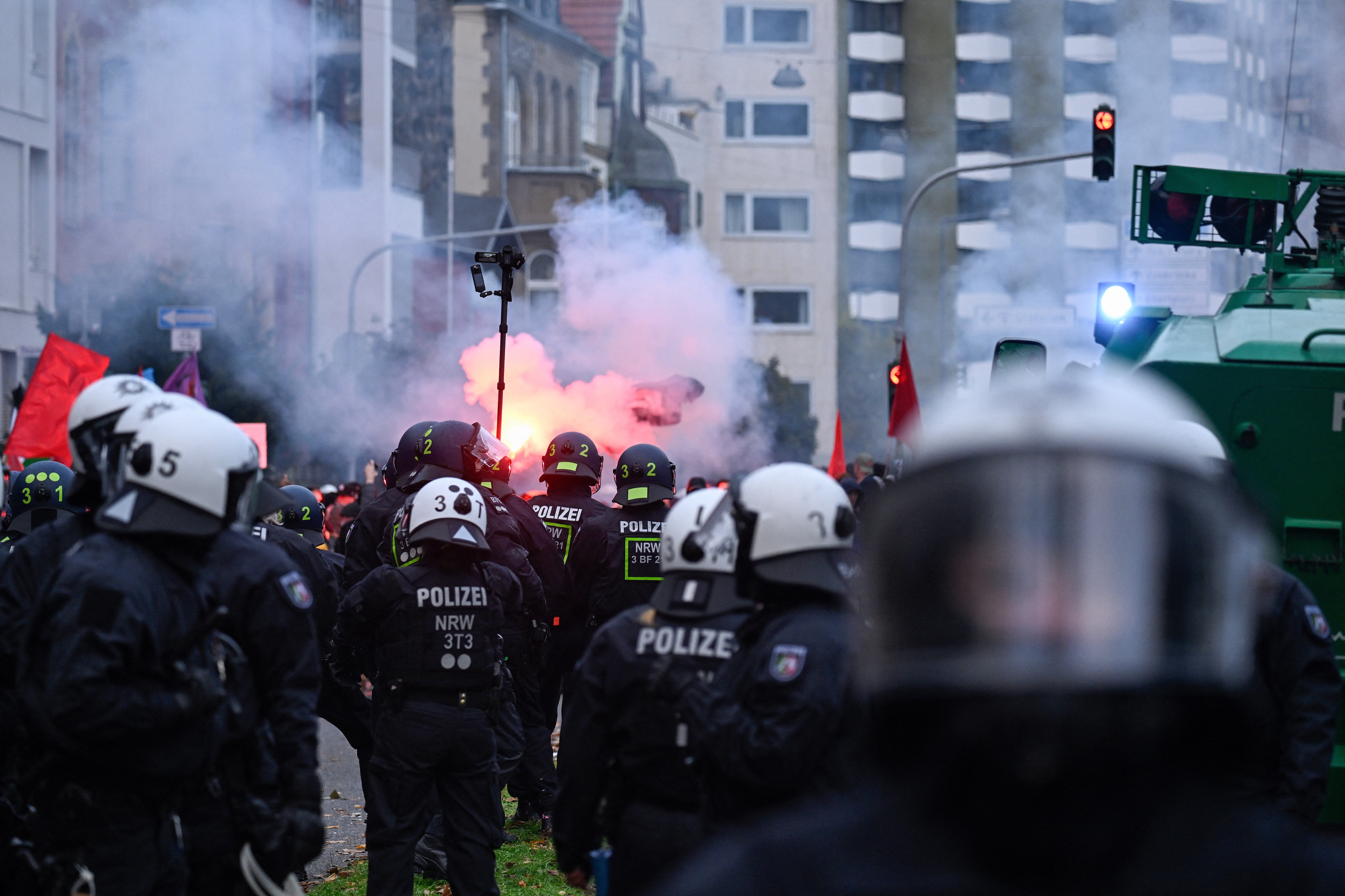 German protesters facing riot police during a demonstration organised by 