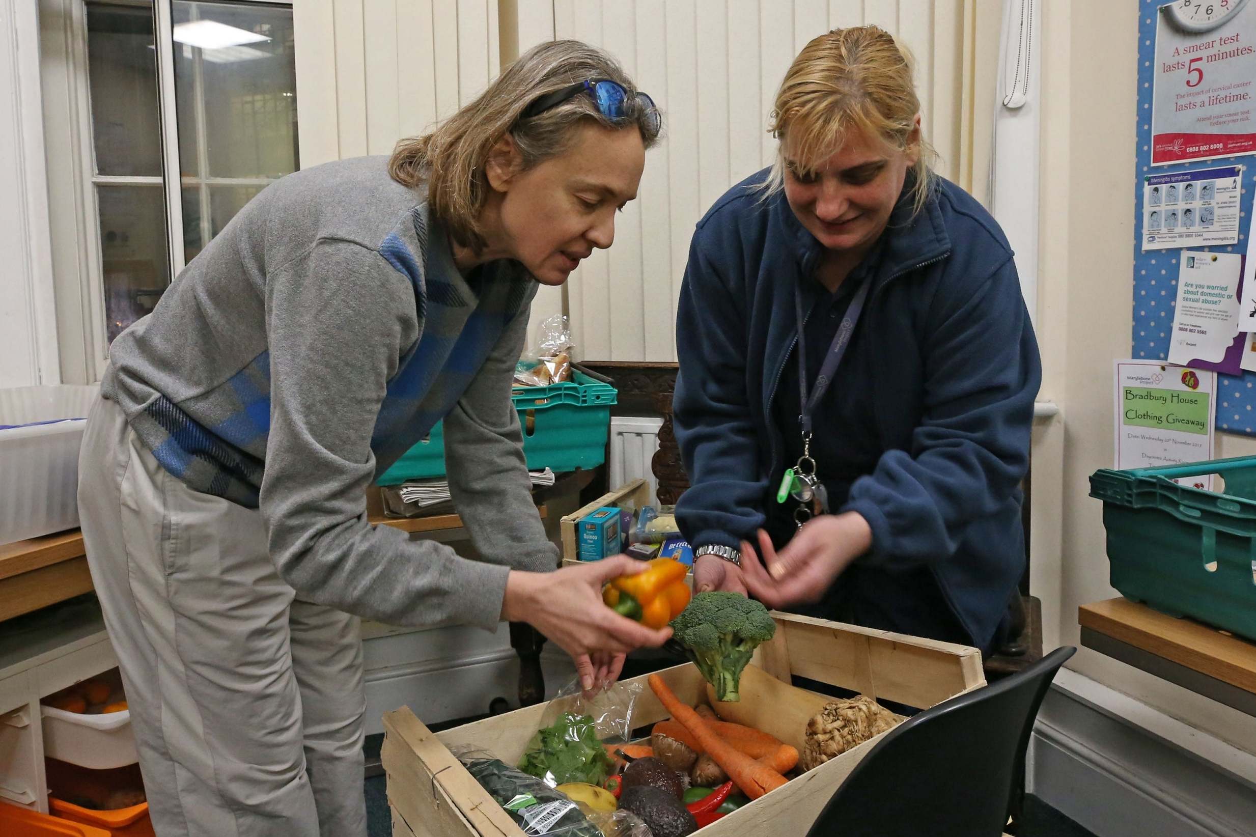 Marylebone Project worker Eva Karacsonyi (right) and resident Olga Baranovskaya check out the fresh delivery (Nigel Howard ©)