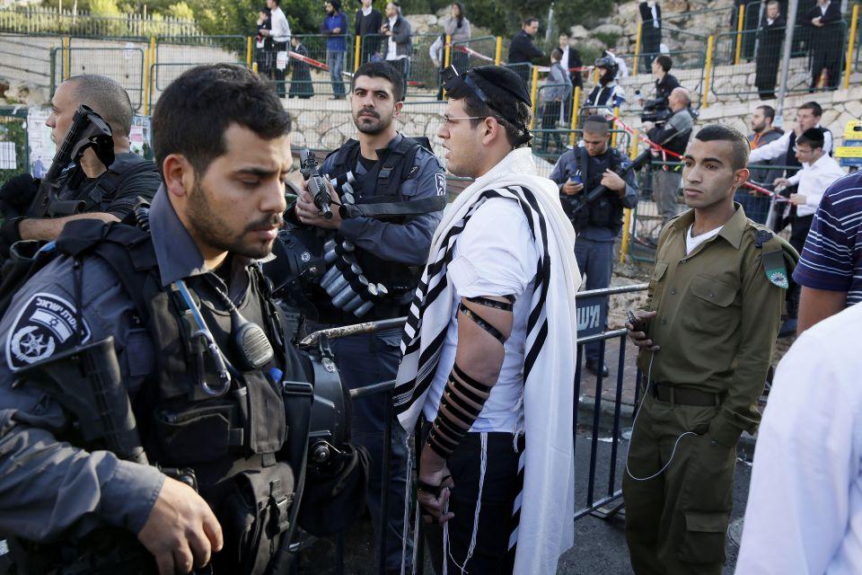 Israeli security forces secure the scene of a recent terrorist attack on civilians in Jerusalem