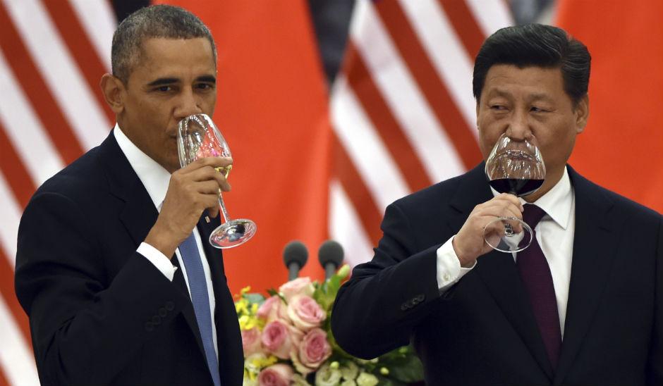 Barack Obama and Xi Jinping finalised the deal at the Apec summit in Beijing (Picture: AP)