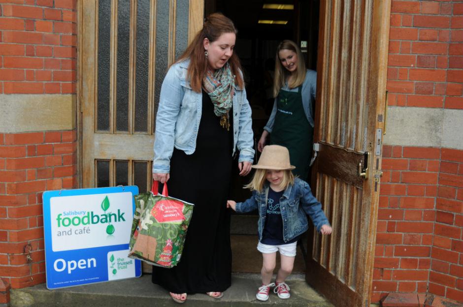 Holly Jones, 29, and her five-year-old daughter Phoebe getting help at a food bank in Chichester, Sussex