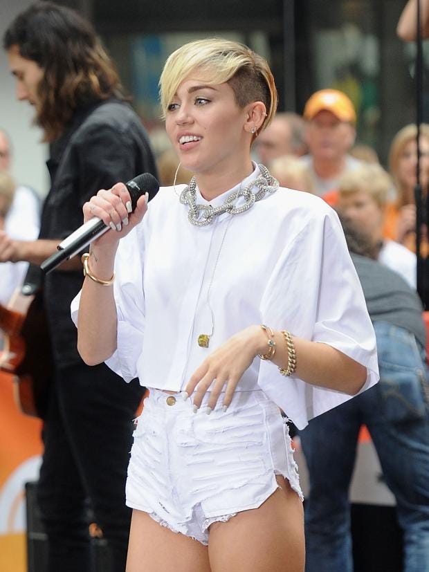 Miley Cyrus sets the holidays on fire with a provocative 