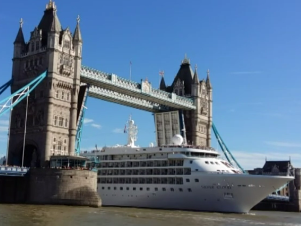 Watch a huge cruise ship squeeze through Tower Bridge | The Independent